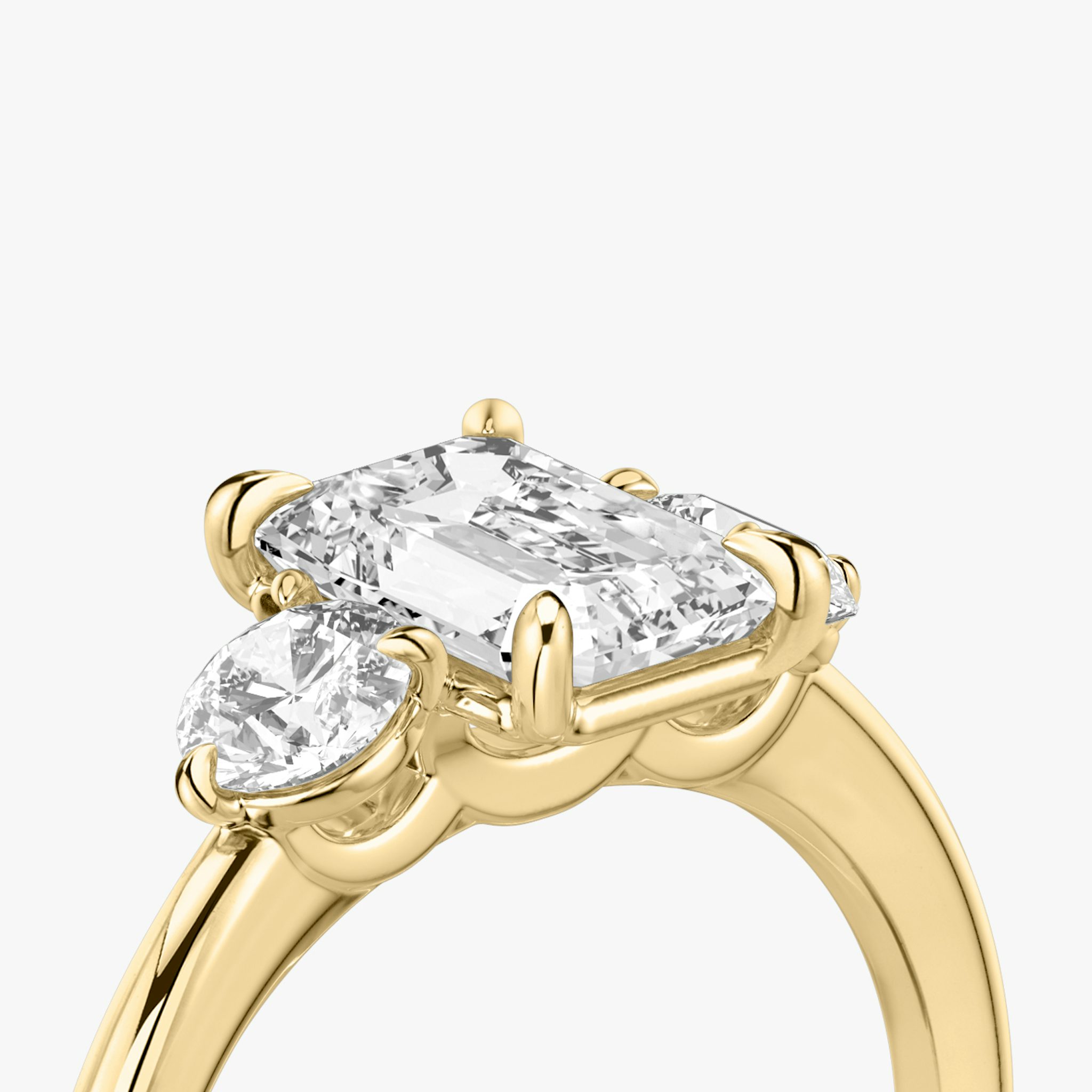 The Three Stone | Emerald | 18k | Yellow Gold | bandAccent: Plain | sideStoneCarat: 0.25ct | sideStoneShape: Round Brilliant | diamondOrientation: vertical | caratWeight: other