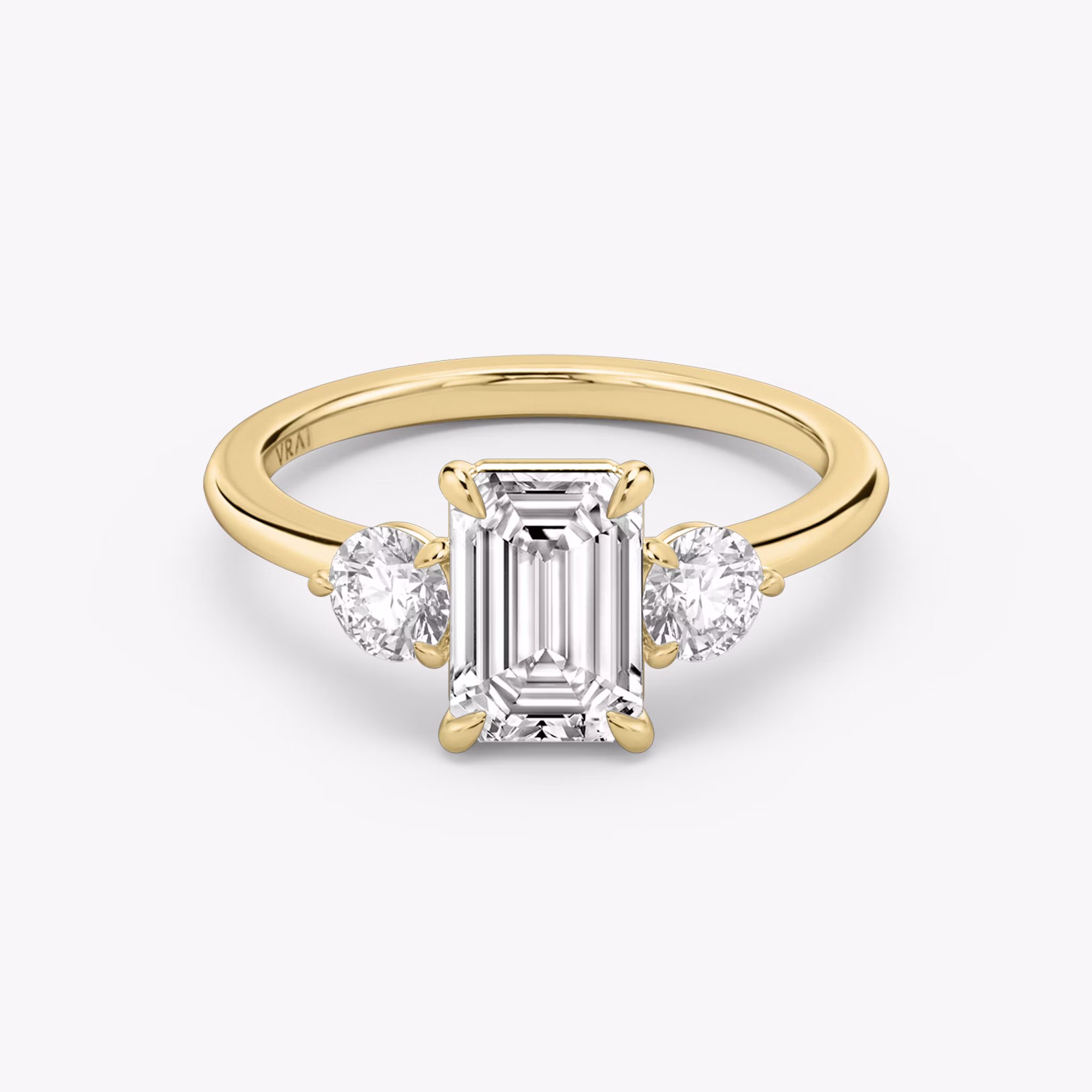 The Three Stone | Emerald | 18k | Yellow Gold | bandAccent: Plain | sideStoneCarat: 0.25ct | sideStoneShape: Round Brilliant | diamondOrientation: vertical | caratWeight: other