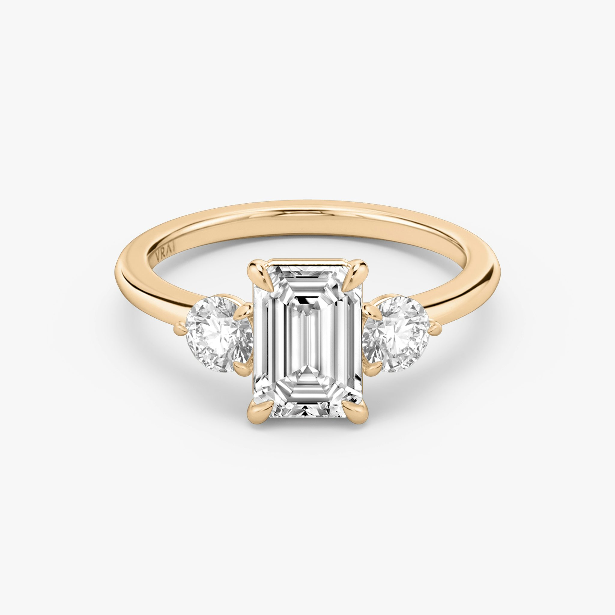 The Three Stone | Emerald | 14k | Rose Gold | bandAccent: Plain | sideStoneCarat: 0.25ct | sideStoneShape: Round Brilliant | diamondOrientation: vertical | caratWeight: other