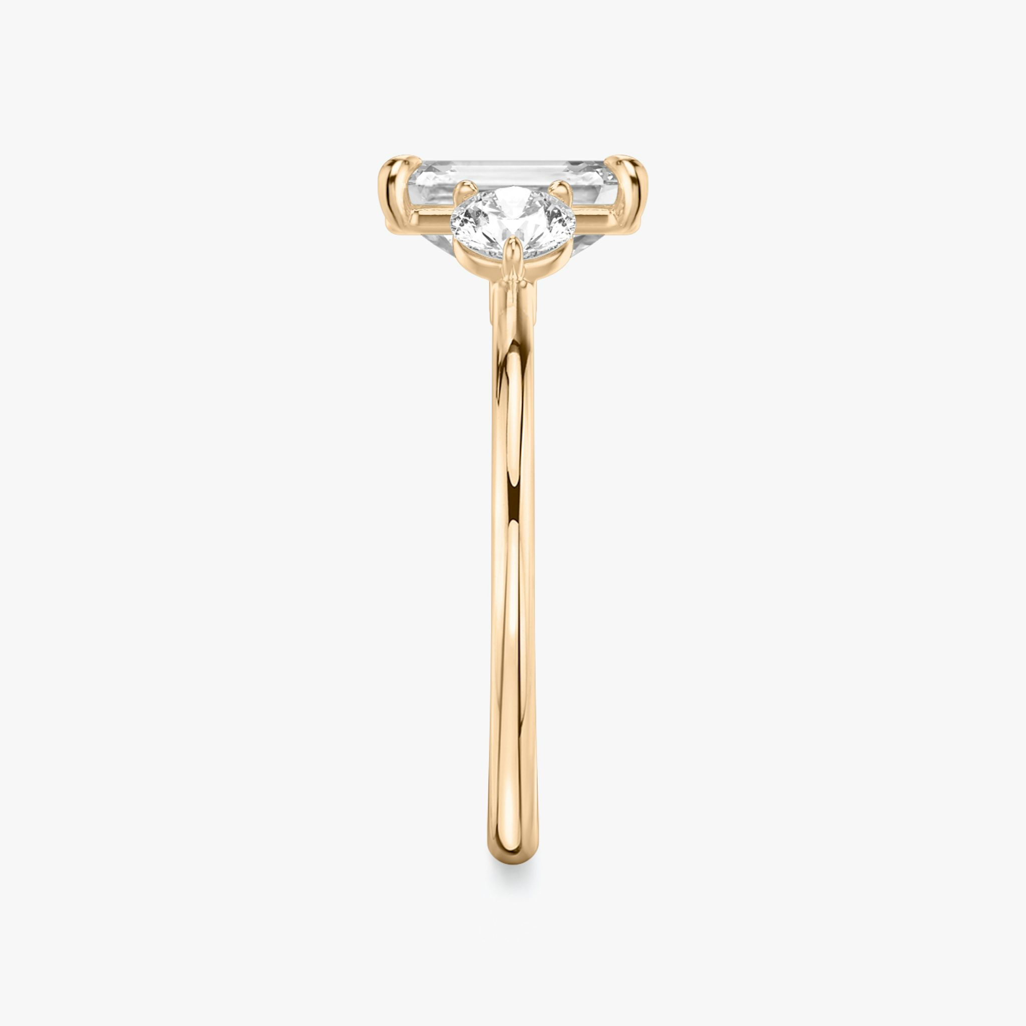 The Three Stone | Emerald | 14k | Rose Gold | bandAccent: Plain | sideStoneCarat: 0.25ct | sideStoneShape: Round Brilliant | diamondOrientation: vertical | caratWeight: other