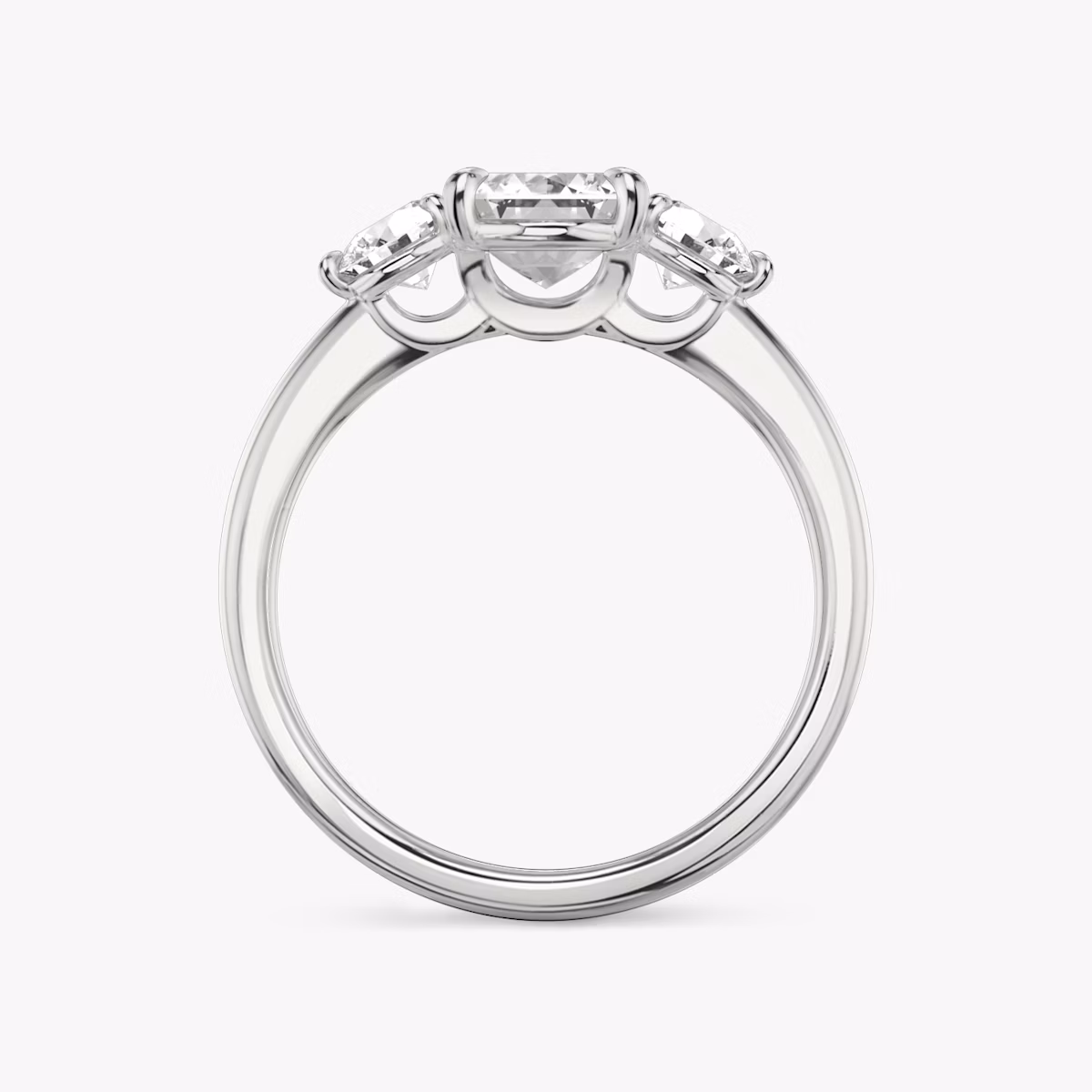 The Three Stone | Emerald | Platinum | bandAccent: Plain | sideStoneCarat: 0.25ct | sideStoneShape: Round Brilliant | diamondOrientation: vertical | caratWeight: other