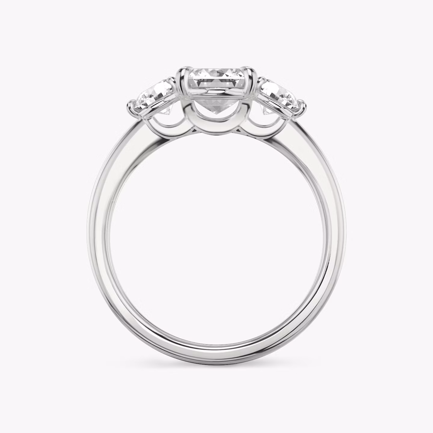 The Three Stone | Emerald | Platinum | bandAccent: Plain | sideStoneCarat: 0.25ct | sideStoneShape: Round Brilliant | diamondOrientation: vertical | caratWeight: other