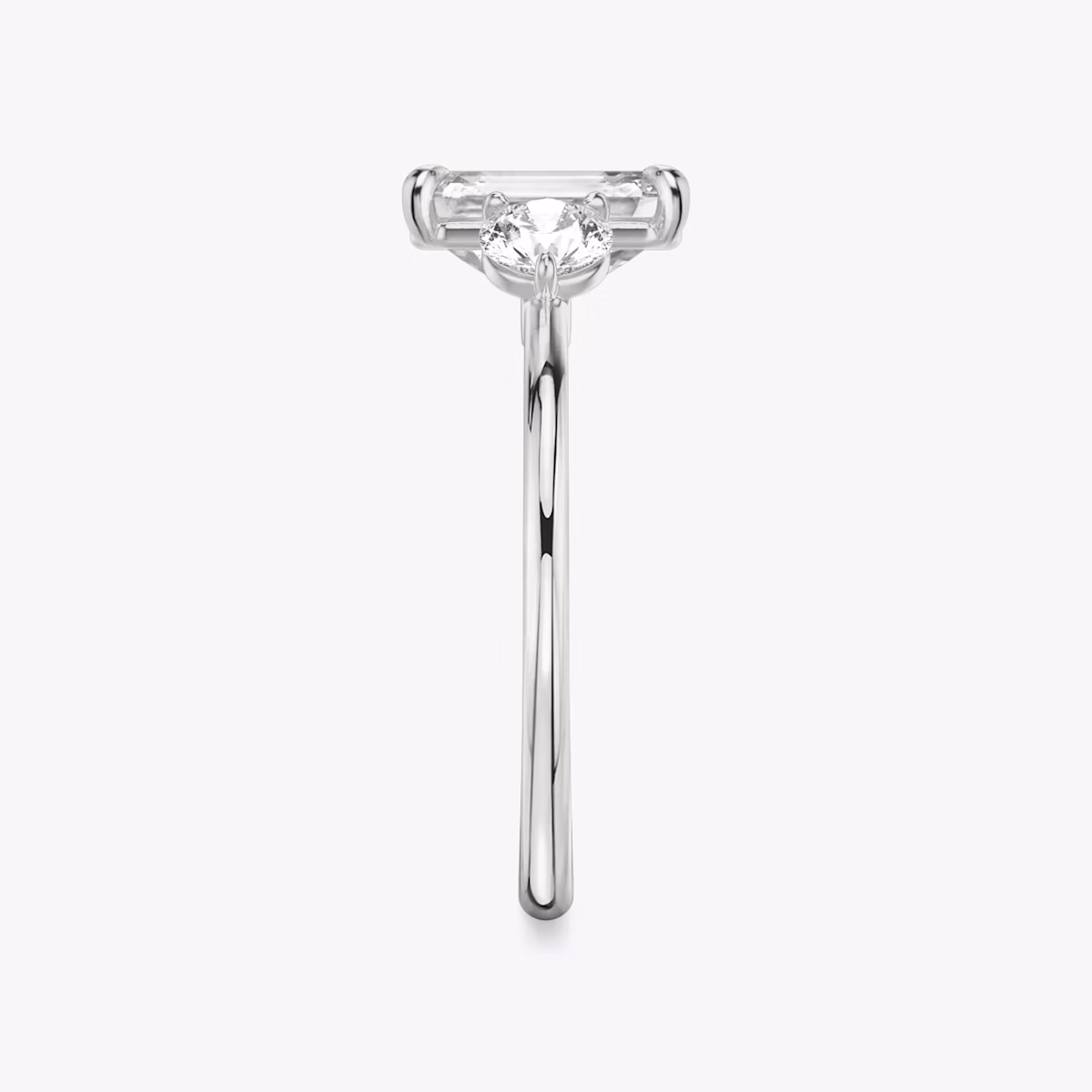 The Three Stone | Emerald | Platinum | bandAccent: Plain | sideStoneCarat: 0.25ct | sideStoneShape: Round Brilliant | diamondOrientation: vertical | caratWeight: other