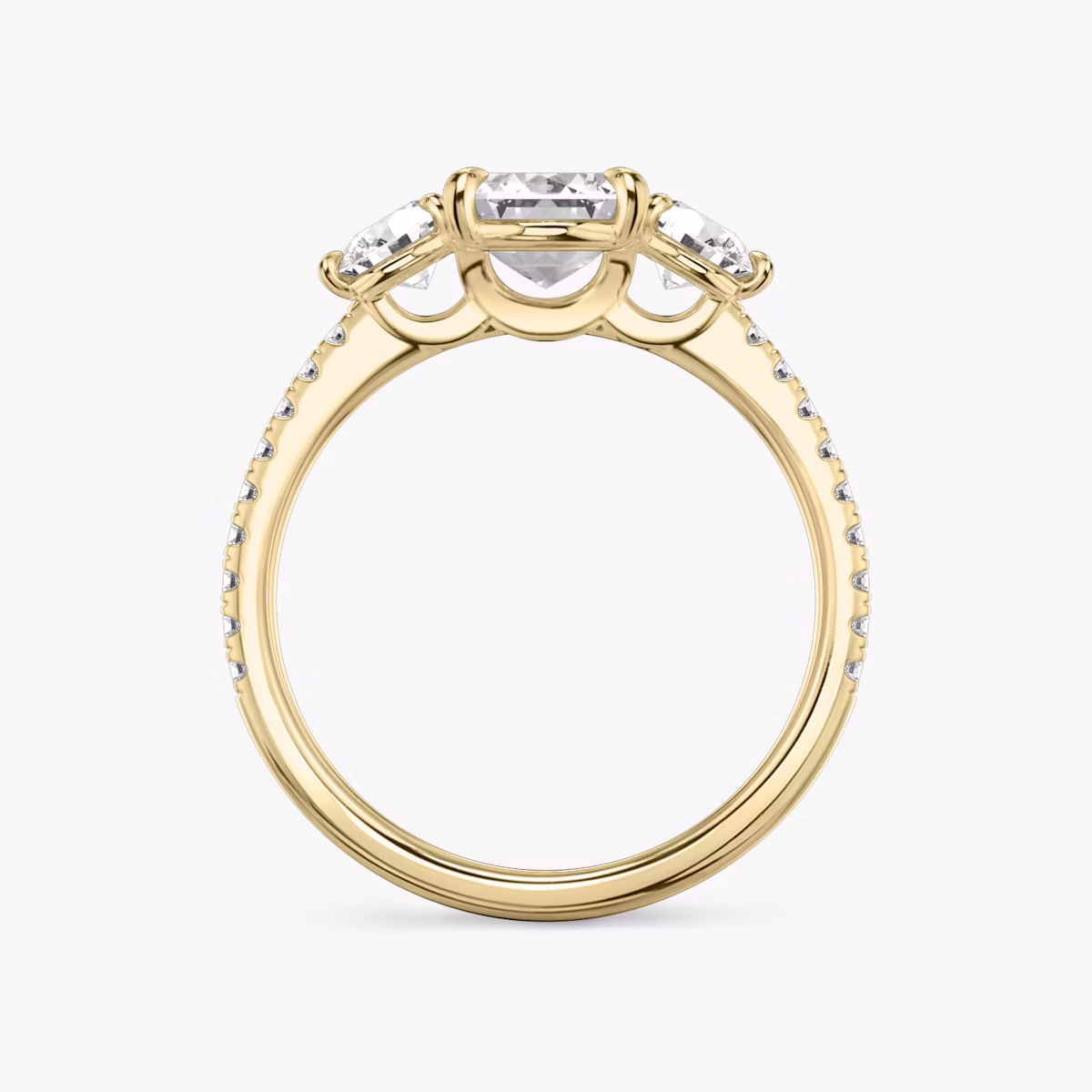 The Three Stone | Emerald | 18k | Yellow Gold | bandAccent: Pavé | sideStoneCarat: 0.25ct | sideStoneShape: Round Brilliant | diamondOrientation: vertical | caratWeight: other
