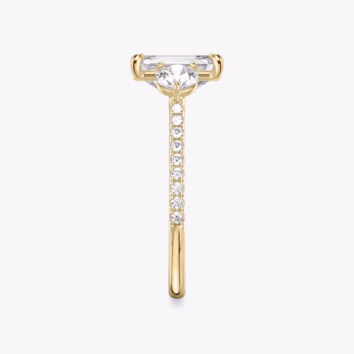 The Three Stone | Emerald | 18k | Yellow Gold | bandAccent: Pavé | sideStoneCarat: 0.25ct | sideStoneShape: Round Brilliant | diamondOrientation: vertical | caratWeight: other
