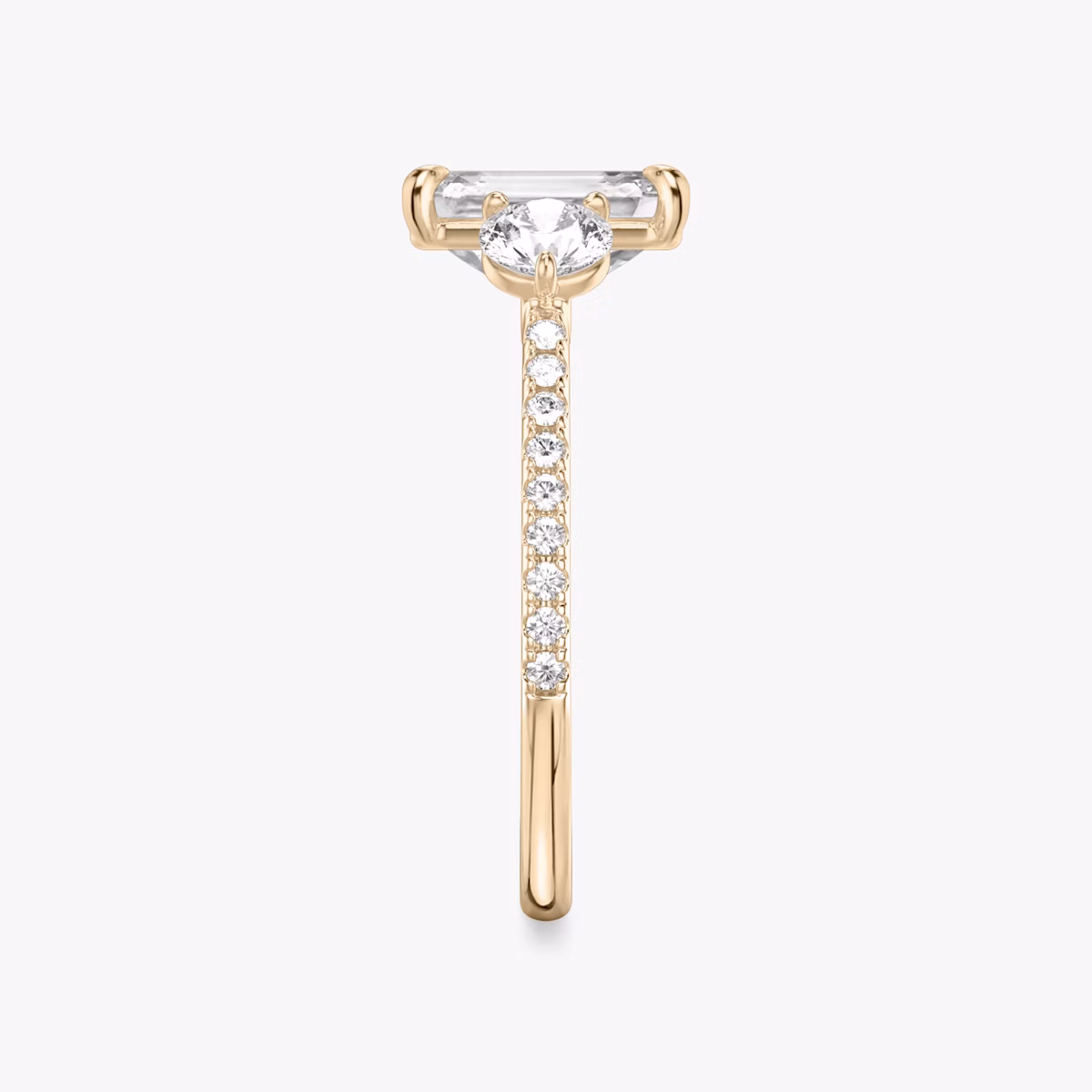 The Three Stone | Emerald | 14k | Rose Gold | bandAccent: Pavé | sideStoneCarat: 0.25ct | sideStoneShape: Round Brilliant | diamondOrientation: vertical | caratWeight: other