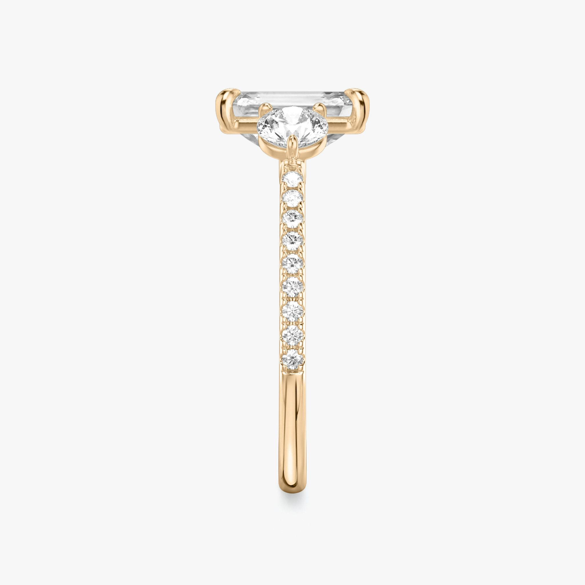 The Three Stone | Emerald | 14k | Rose Gold | bandAccent: Pavé | sideStoneCarat: 0.25ct | sideStoneShape: Round Brilliant | diamondOrientation: vertical | caratWeight: other