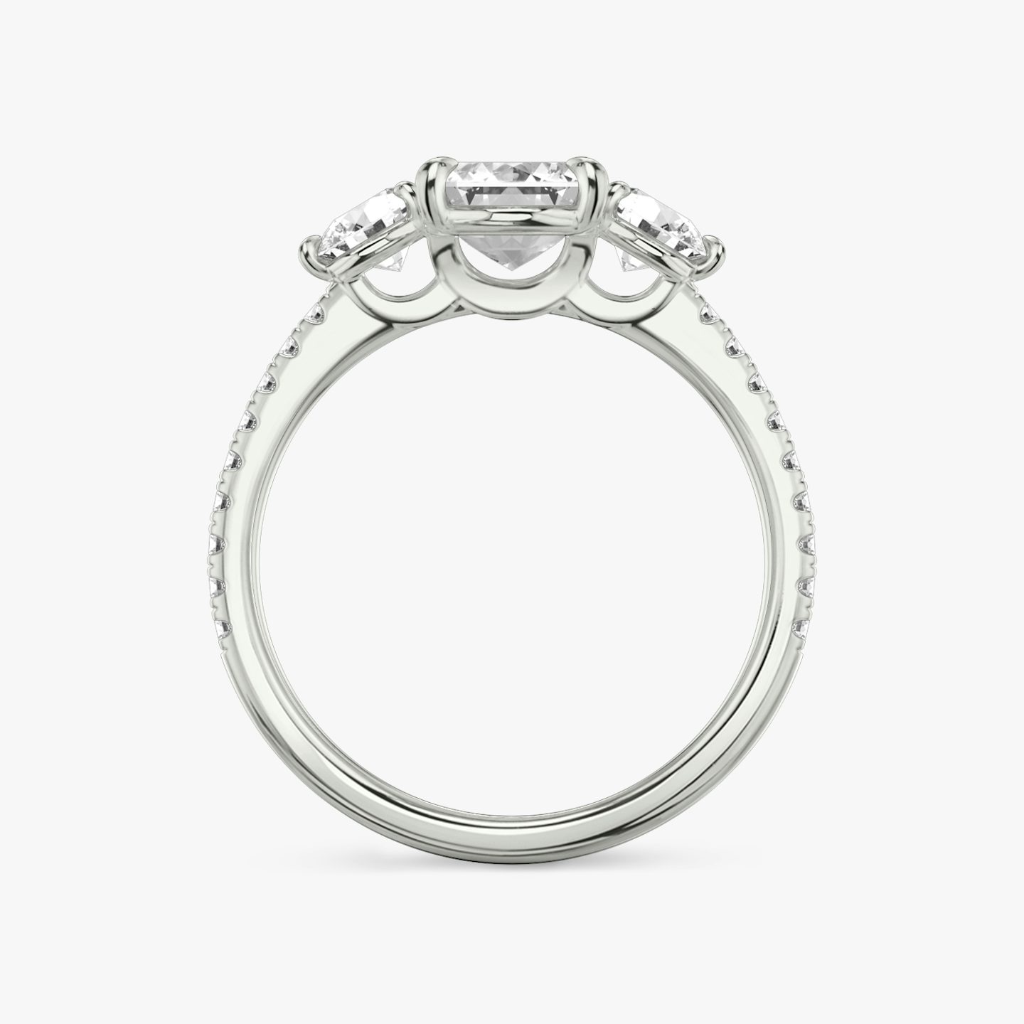 The Three Stone | Emerald | Platinum | bandAccent: Pavé | sideStoneCarat: 0.25ct | sideStoneShape: Round Brilliant | diamondOrientation: vertical | caratWeight: other