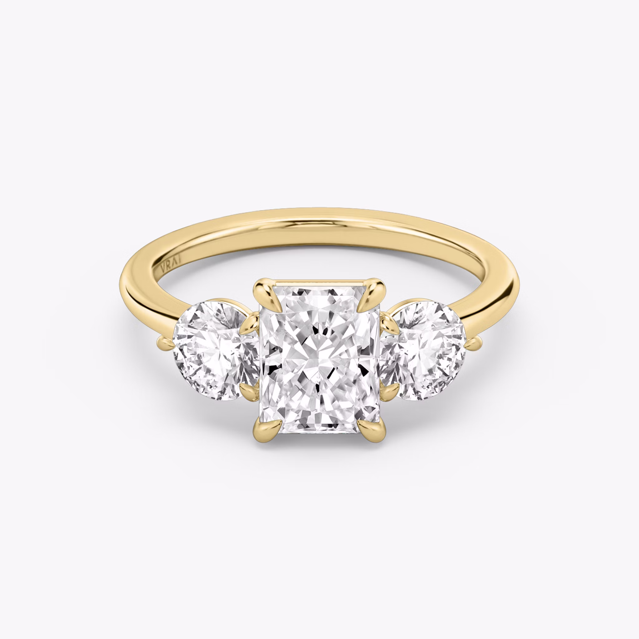 The Three Stone | Radiant | 18k | Yellow Gold | bandAccent: Plain | sideStoneCarat: 0.50ct | sideStoneShape: Round Brilliant | diamondOrientation: vertical | caratWeight: other