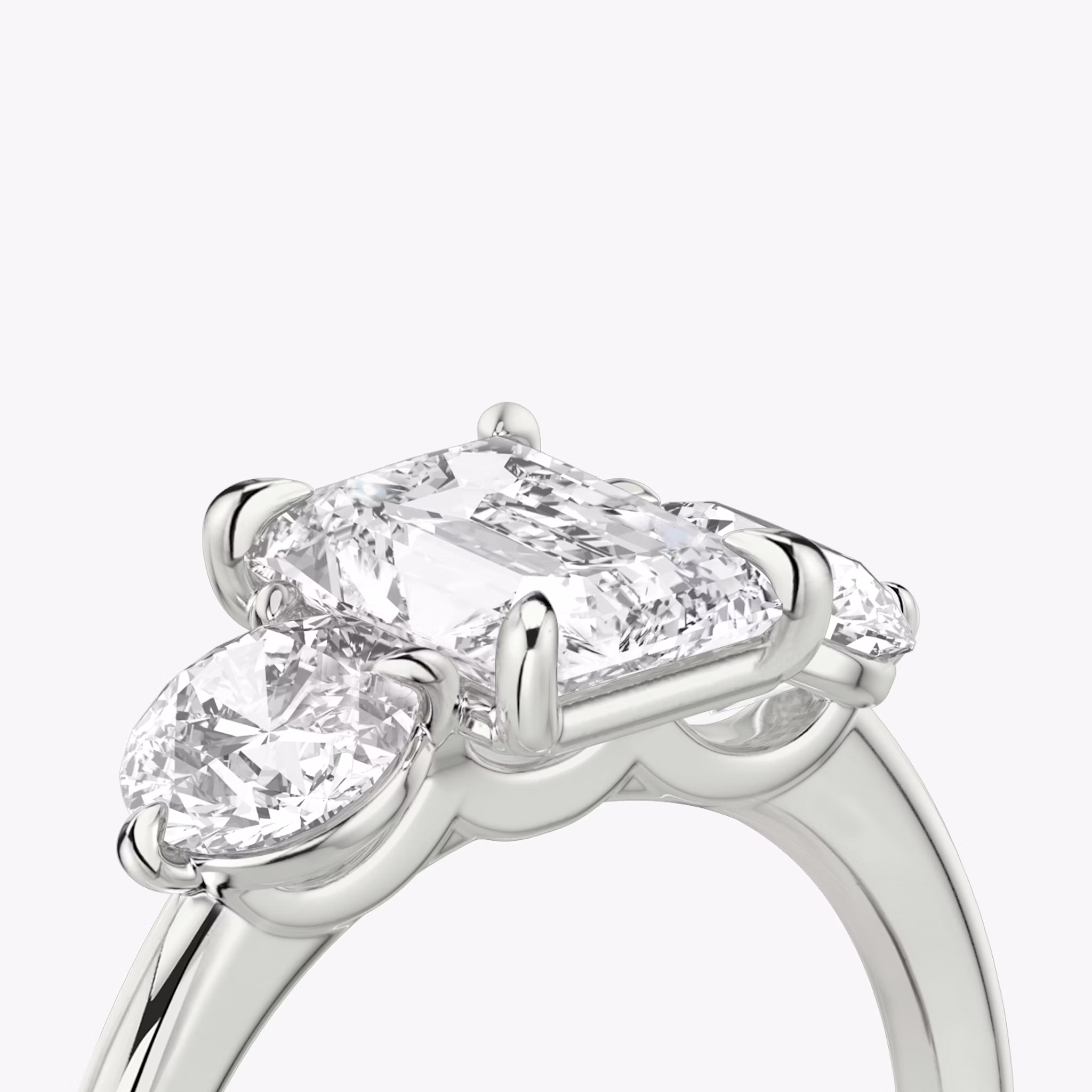The Three Stone | Radiant | 18k | White Gold | bandAccent: Plain | sideStoneCarat: 0.50ct | sideStoneShape: Round Brilliant | diamondOrientation: vertical | caratWeight: other