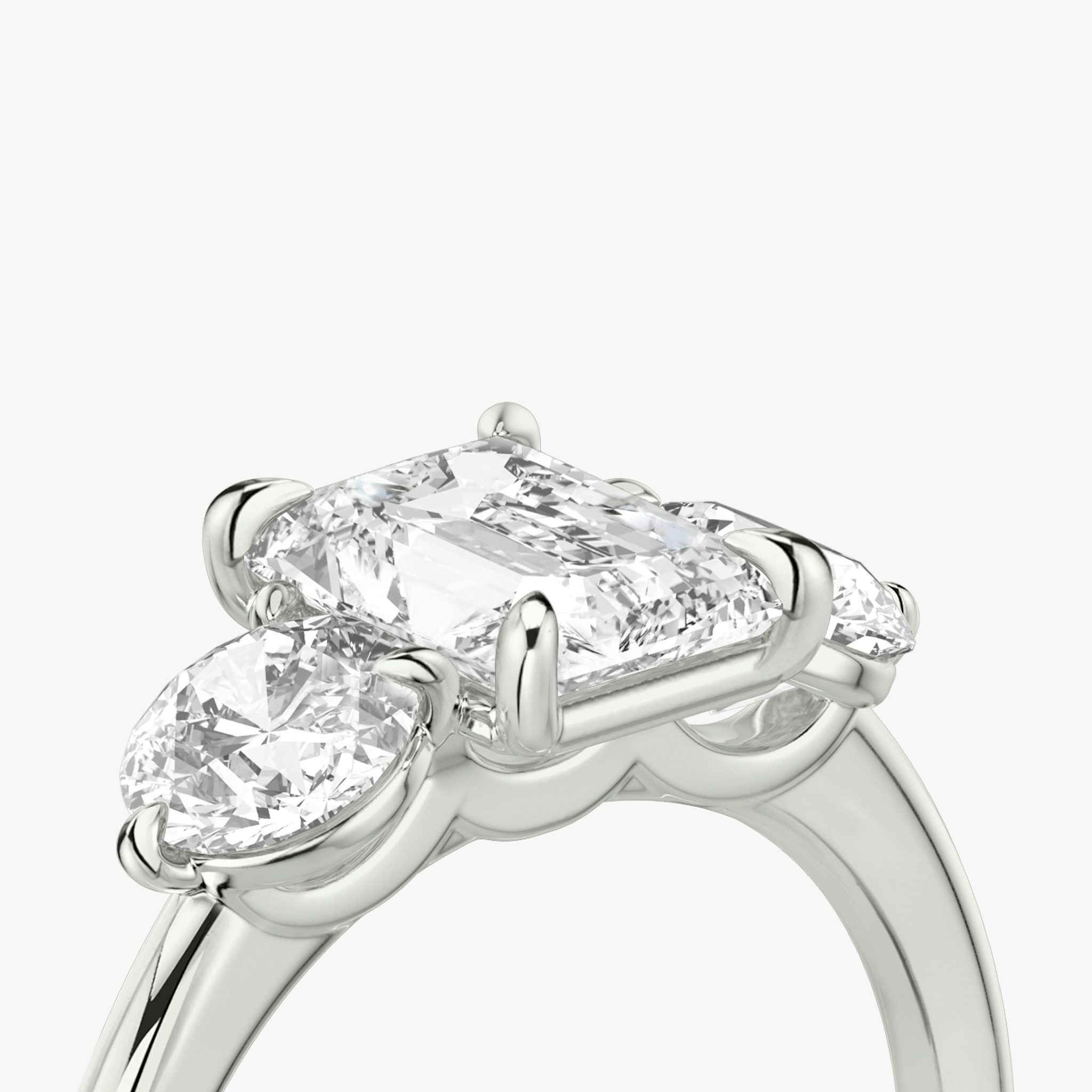 The Three Stone | Radiant | 18k | White Gold | bandAccent: Plain | sideStoneCarat: 0.50ct | sideStoneShape: Round Brilliant | diamondOrientation: vertical | caratWeight: other