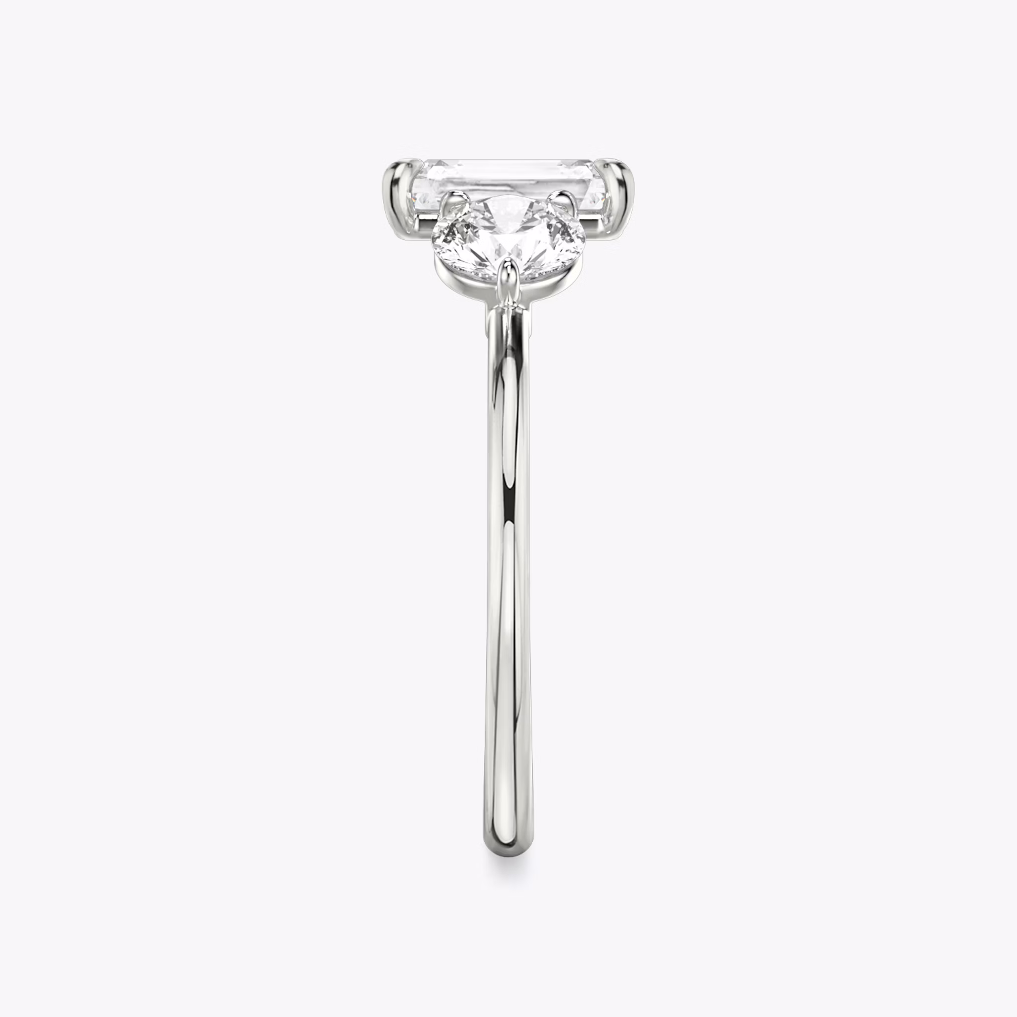 The Three Stone | Radiant | 18k | White Gold | bandAccent: Plain | sideStoneCarat: 0.50ct | sideStoneShape: Round Brilliant | diamondOrientation: vertical | caratWeight: other