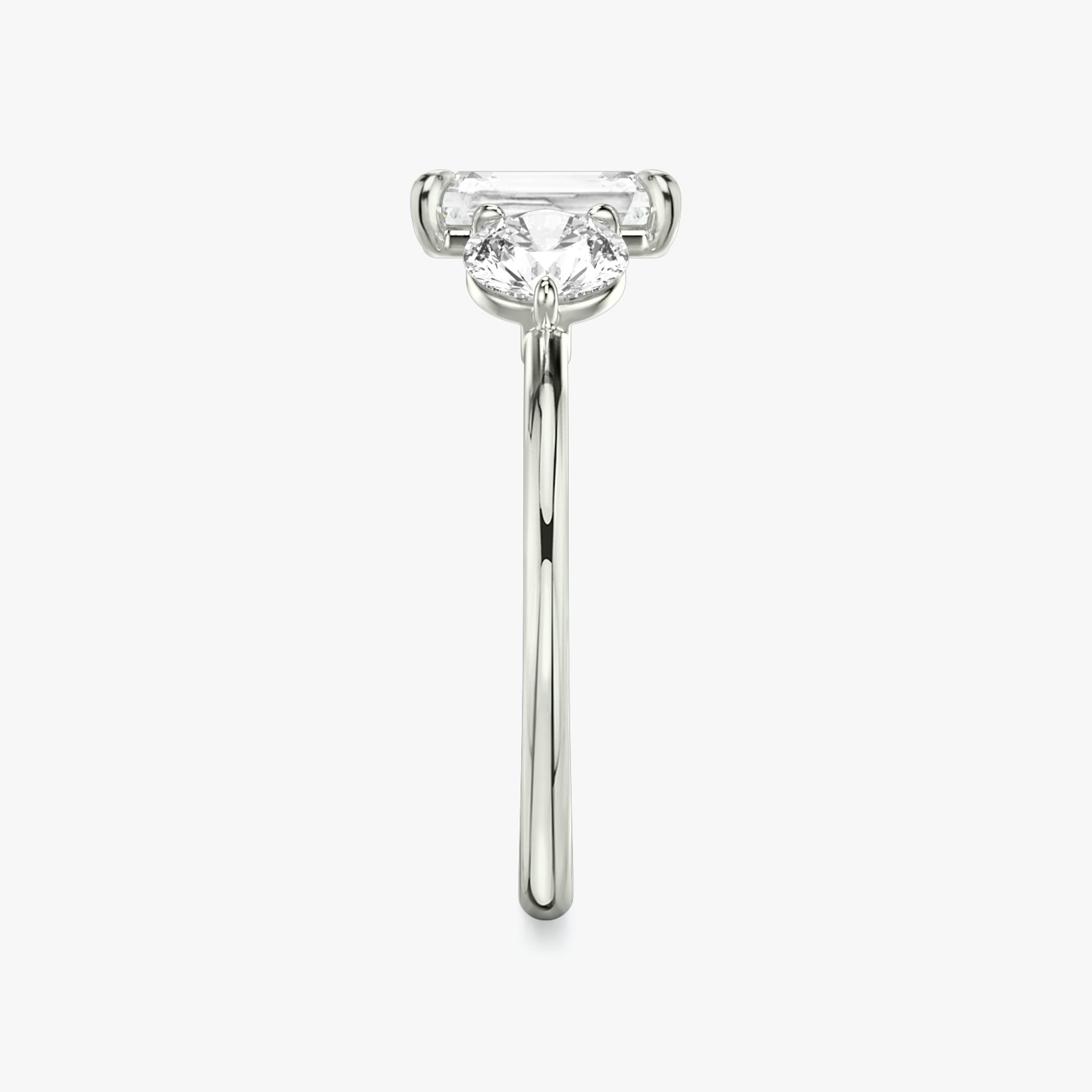 The Three Stone | Radiant | 18k | White Gold | bandAccent: Plain | sideStoneCarat: 0.50ct | sideStoneShape: Round Brilliant | diamondOrientation: vertical | caratWeight: other