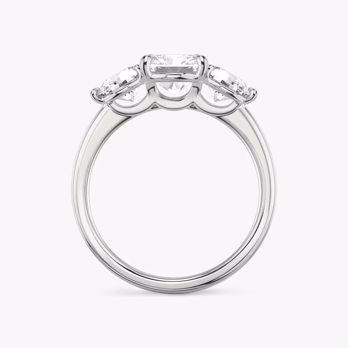 The Three Stone | Radiant | Platinum | bandAccent: Plain | sideStoneCarat: 0.50ct | sideStoneShape: Round Brilliant | diamondOrientation: vertical | caratWeight: other