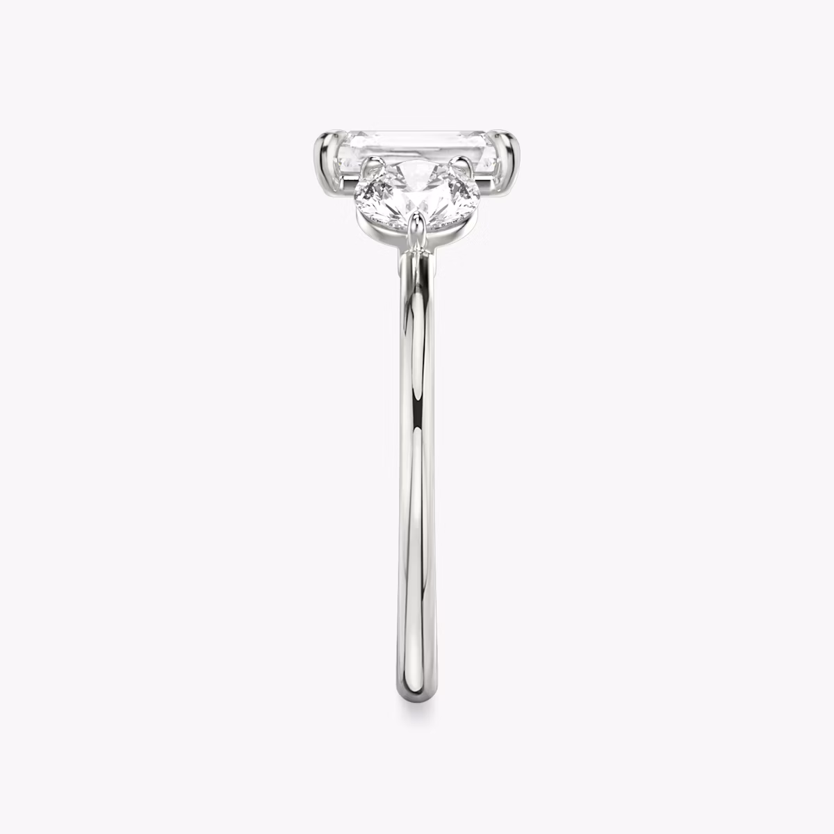 The Three Stone | Radiant | Platinum | bandAccent: Plain | sideStoneCarat: 0.50ct | sideStoneShape: Round Brilliant | diamondOrientation: vertical | caratWeight: other