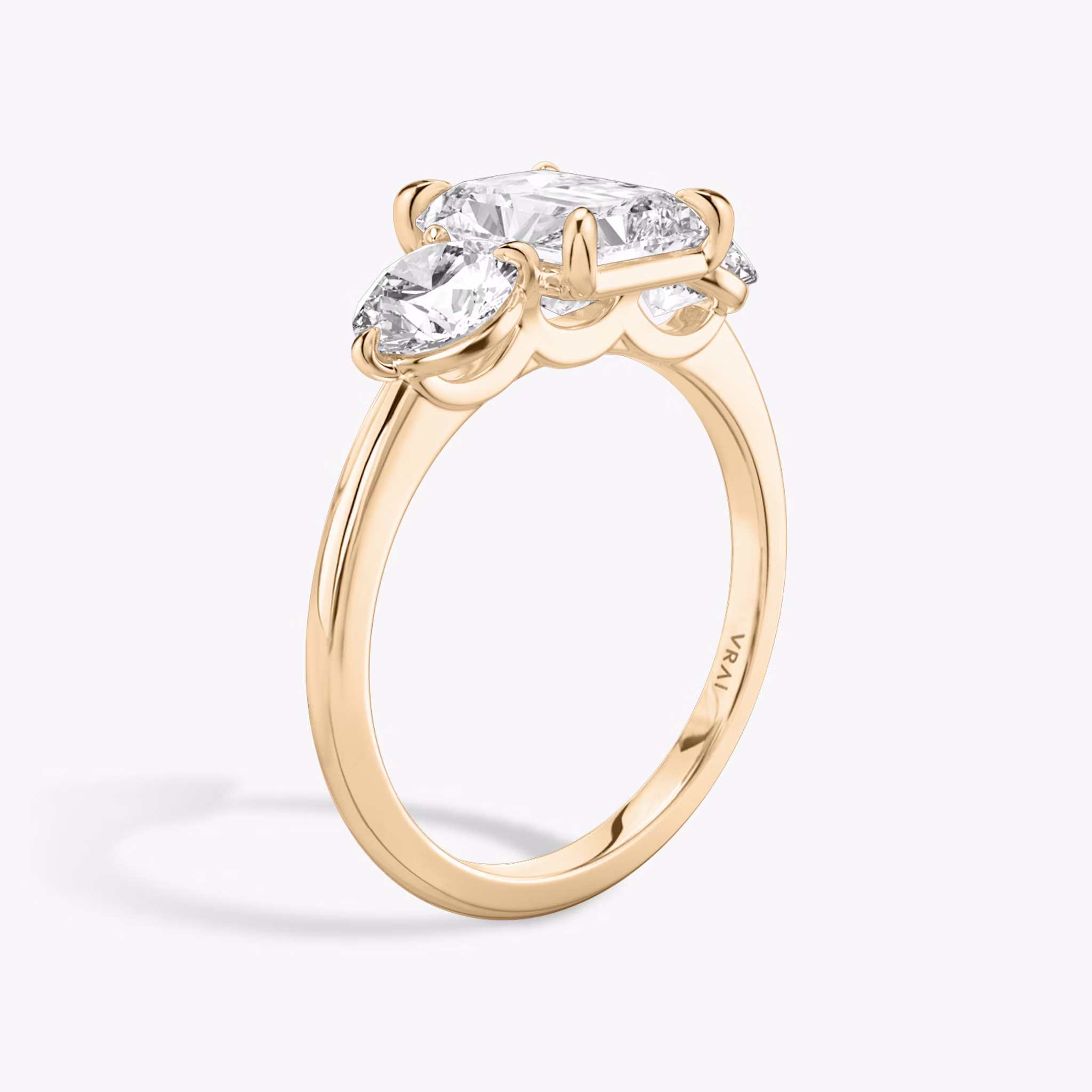 The Three Stone | Radiant | 14k | Rose Gold | bandAccent: Plain | sideStoneCarat: 0.50ct | sideStoneShape: Round Brilliant | diamondOrientation: vertical | caratWeight: other