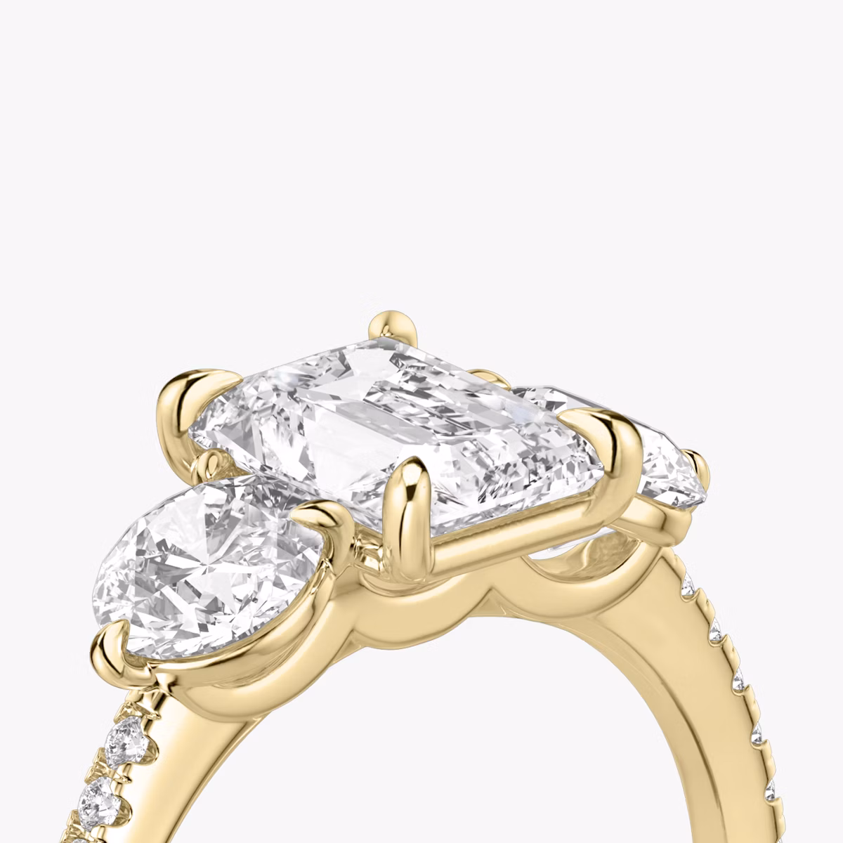 The Three Stone | Radiant | 18k | Yellow Gold | bandAccent: Pavé | sideStoneCarat: 0.50ct | sideStoneShape: Round Brilliant | diamondOrientation: vertical | caratWeight: other