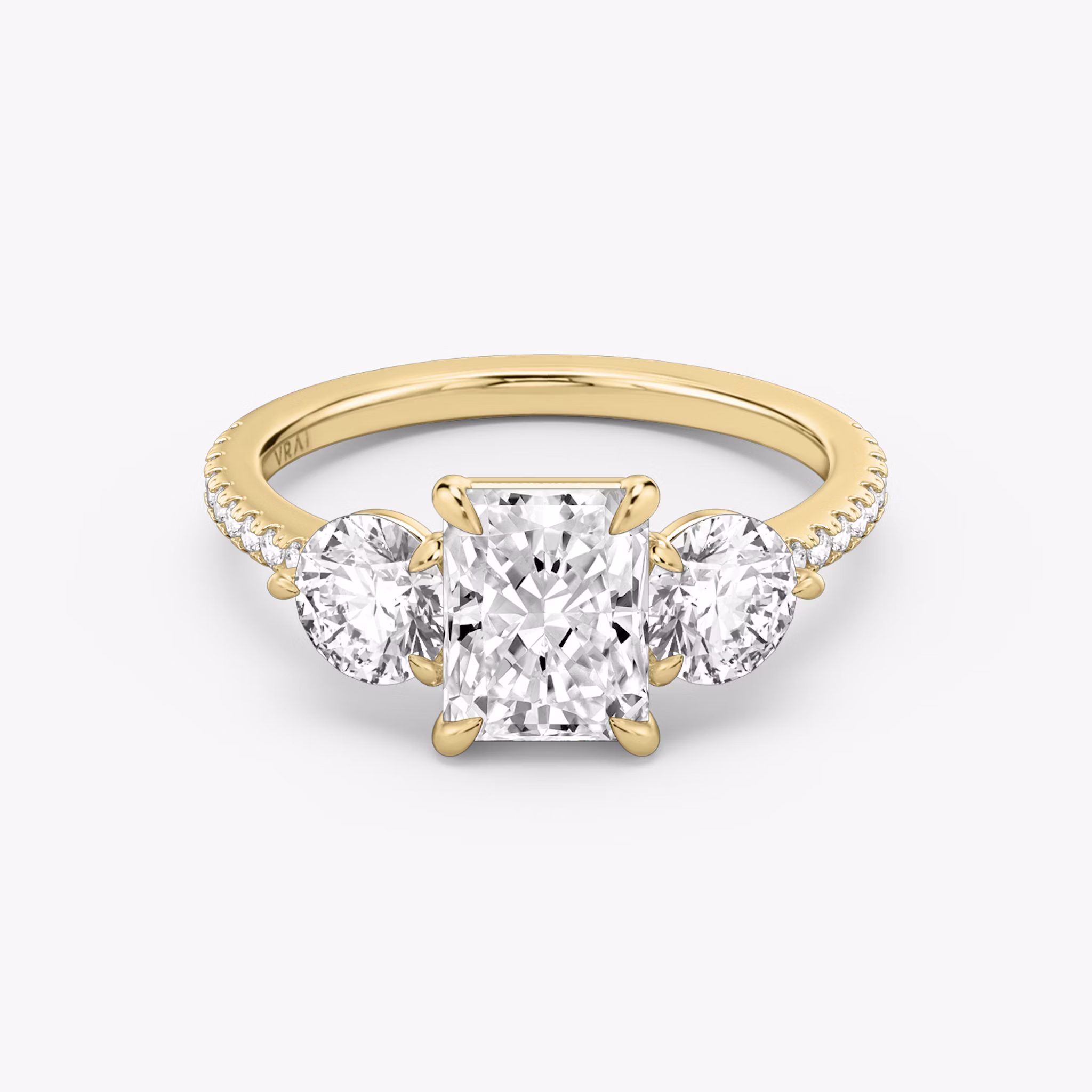 The Three Stone | Radiant | 18k | Yellow Gold | bandAccent: Pavé | sideStoneCarat: 0.50ct | sideStoneShape: Round Brilliant | diamondOrientation: vertical | caratWeight: other
