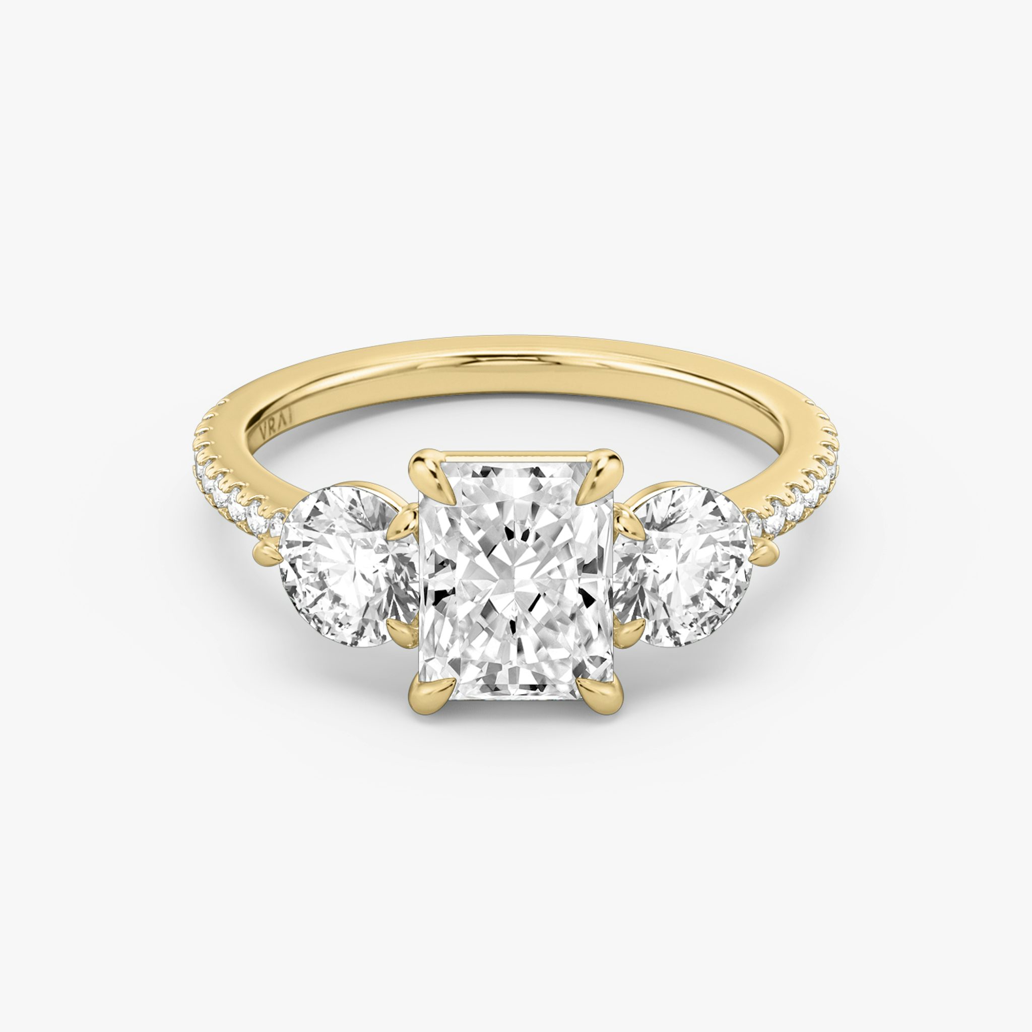 The Three Stone | Radiant | 18k | Yellow Gold | bandAccent: Pavé | sideStoneCarat: 0.50ct | sideStoneShape: Round Brilliant | diamondOrientation: vertical | caratWeight: other