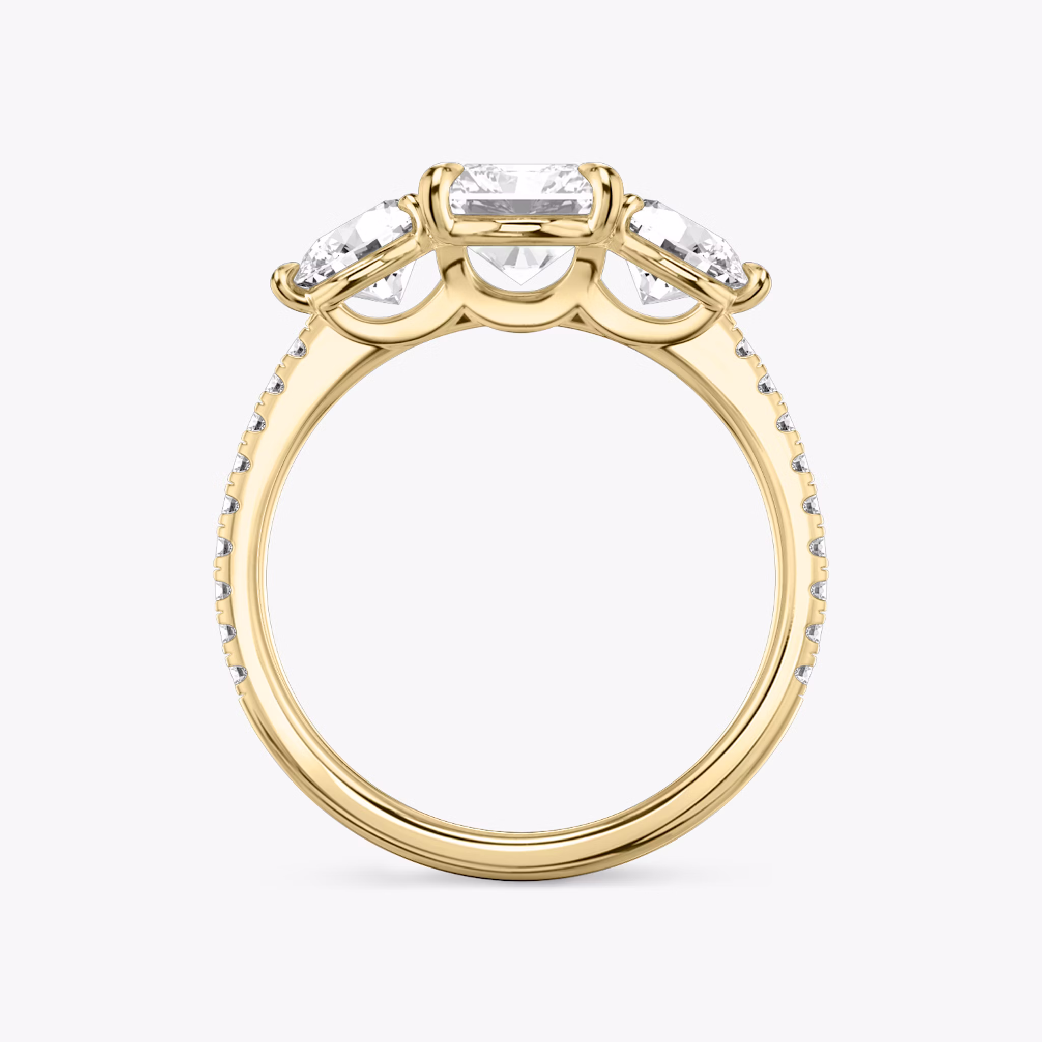 The Three Stone | Radiant | 18k | Yellow Gold | bandAccent: Pavé | sideStoneCarat: 0.50ct | sideStoneShape: Round Brilliant | diamondOrientation: vertical | caratWeight: other