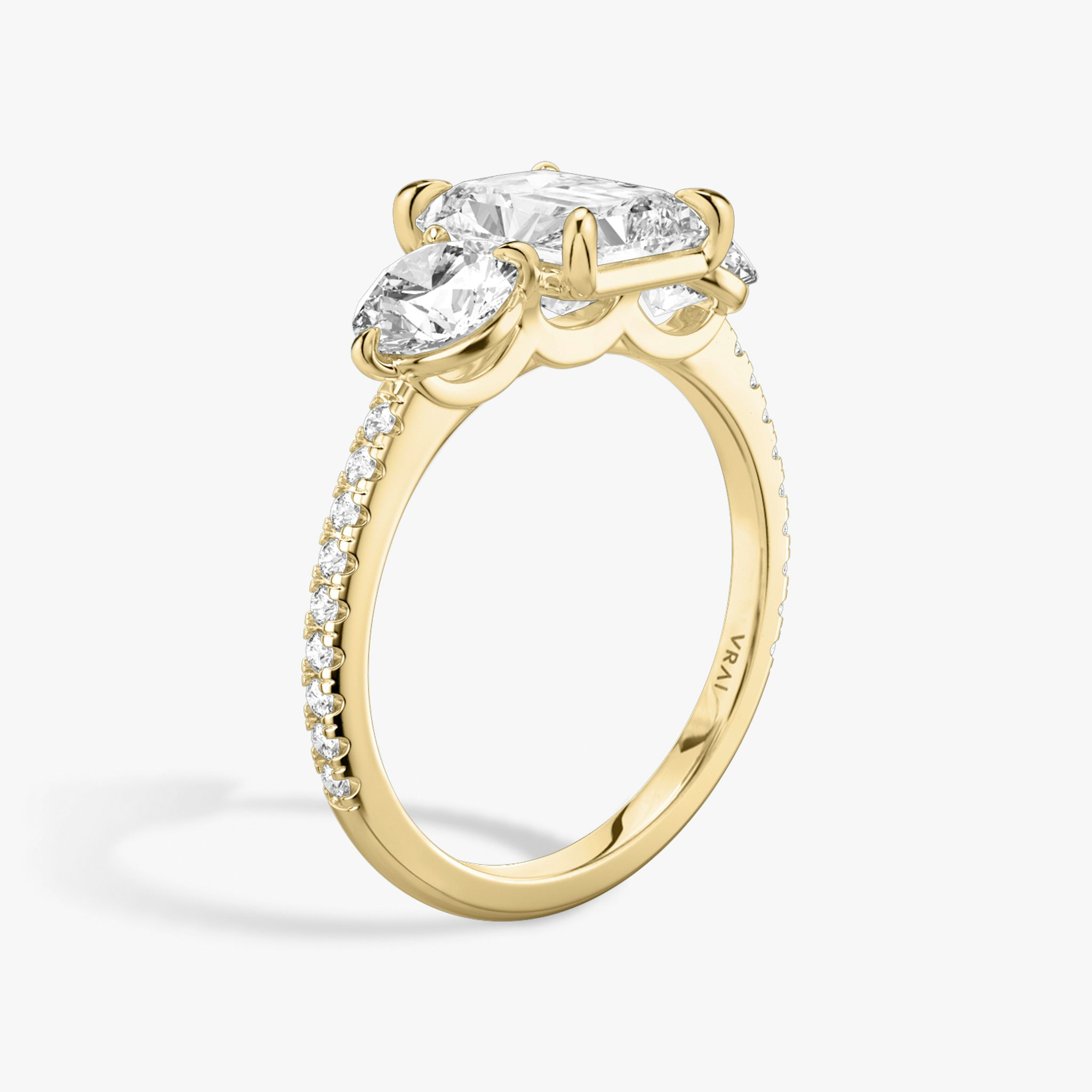The Three Stone | Radiant | 18k | Yellow Gold | bandAccent: Pavé | sideStoneCarat: 0.50ct | sideStoneShape: Round Brilliant | diamondOrientation: vertical | caratWeight: other