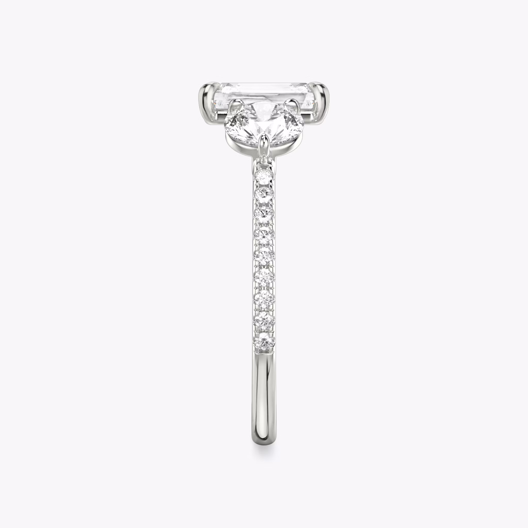 The Three Stone | Radiant | 18k | White Gold | bandAccent: Pavé | sideStoneCarat: 0.50ct | sideStoneShape: Round Brilliant | diamondOrientation: vertical | caratWeight: other