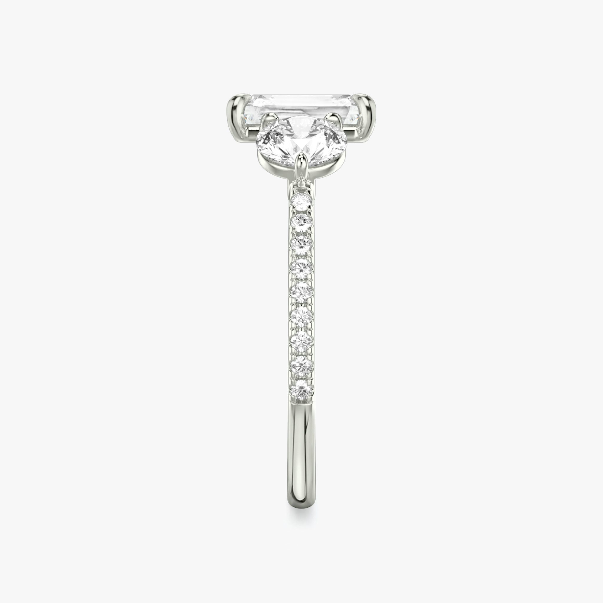 The Three Stone | Radiant | 18k | White Gold | bandAccent: Pavé | sideStoneCarat: 0.50ct | sideStoneShape: Round Brilliant | diamondOrientation: vertical | caratWeight: other