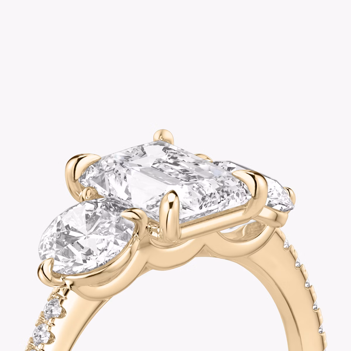 The Three Stone | Radiant | 14k | Rose Gold | bandAccent: Pavé | sideStoneCarat: 0.50ct | sideStoneShape: Round Brilliant | diamondOrientation: vertical | caratWeight: other
