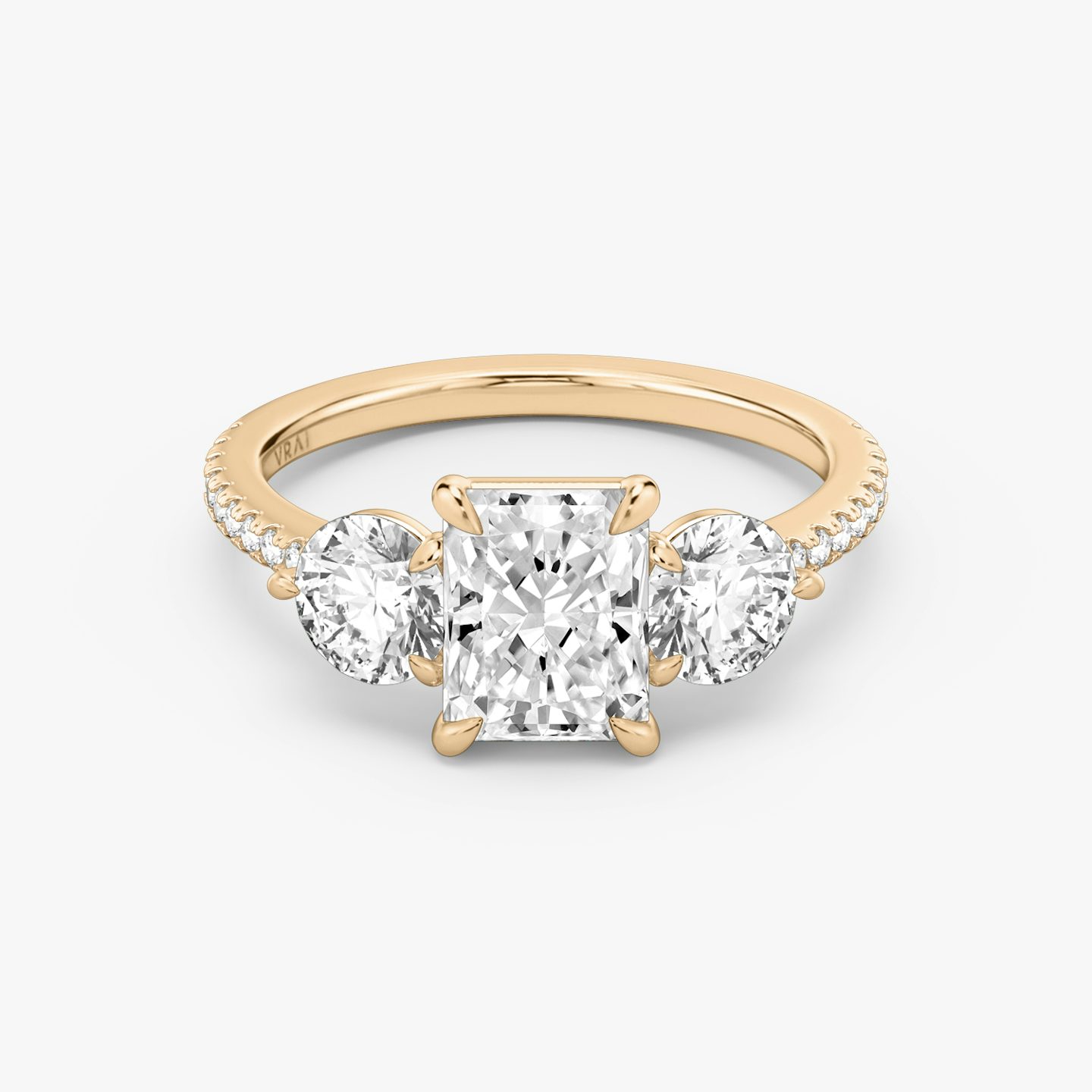 The Three Stone | Radiant | 14k | Rose Gold | bandAccent: Pavé | sideStoneCarat: 0.50ct | sideStoneShape: Round Brilliant | diamondOrientation: vertical | caratWeight: other