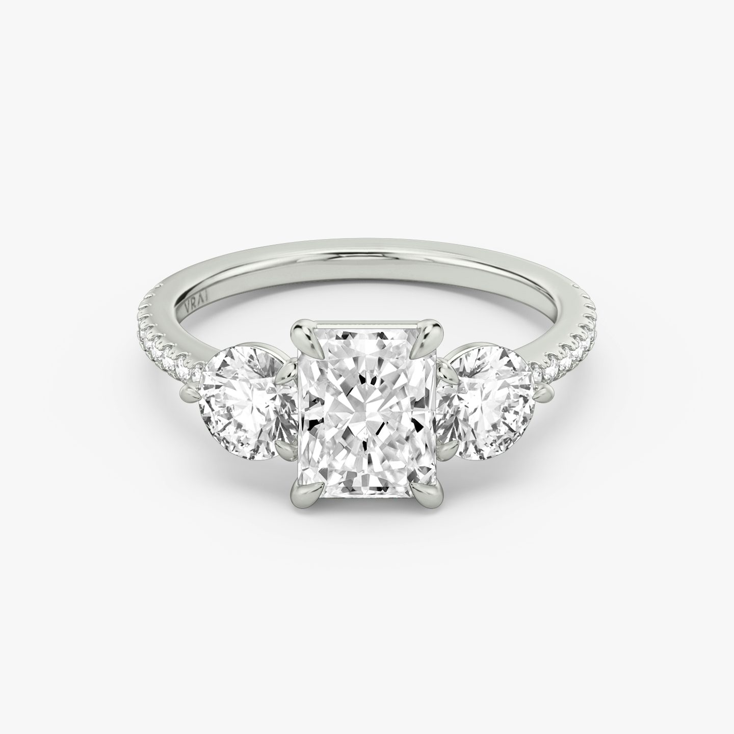 The Three Stone | Radiant | Platinum | bandAccent: Pavé | sideStoneCarat: 0.50ct | sideStoneShape: Round Brilliant | diamondOrientation: vertical | caratWeight: other