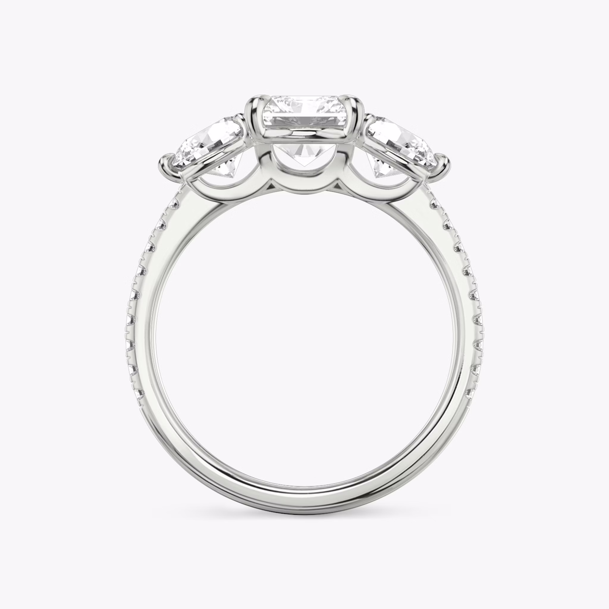 The Three Stone | Radiant | Platinum | bandAccent: Pavé | sideStoneCarat: 0.50ct | sideStoneShape: Round Brilliant | diamondOrientation: vertical | caratWeight: other