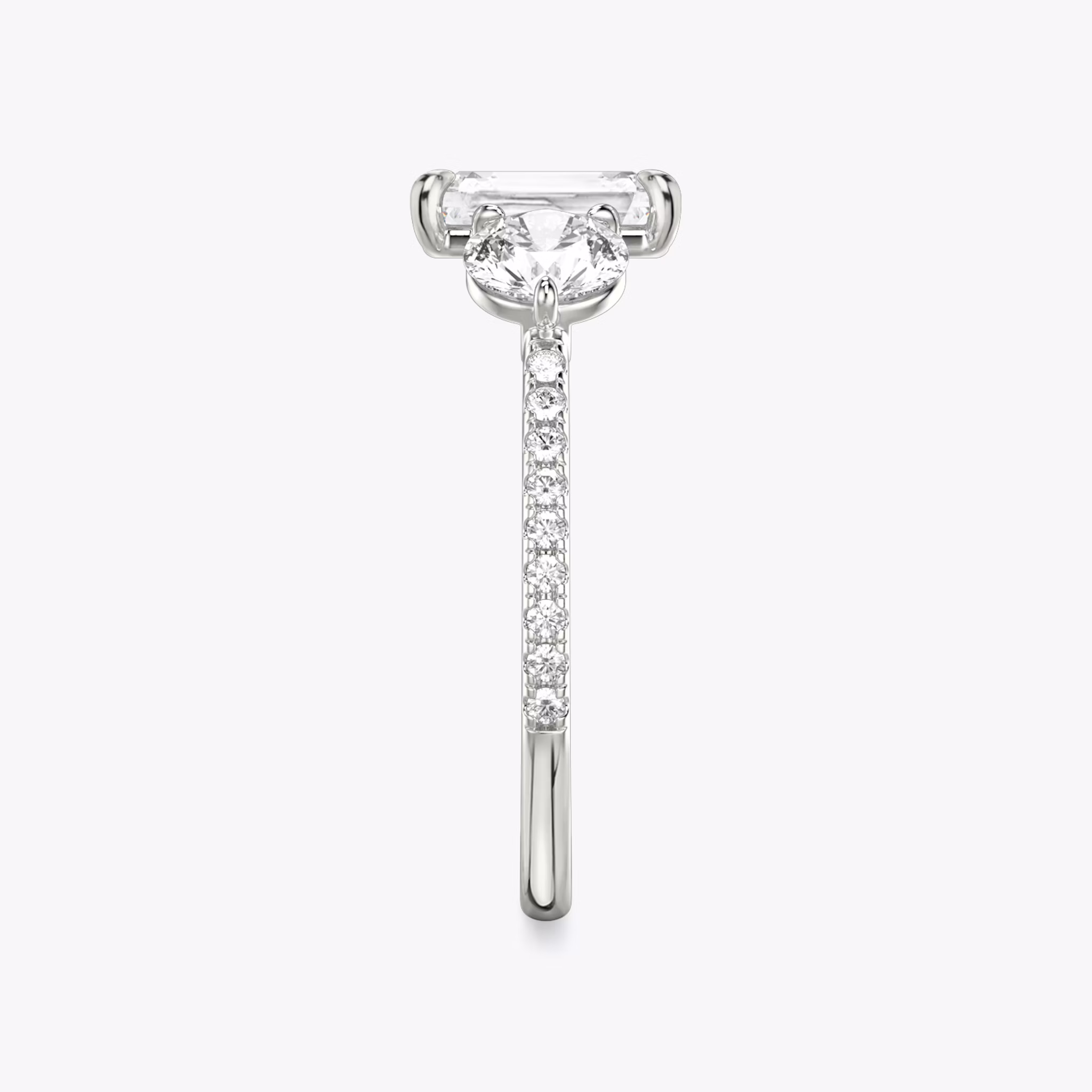 The Three Stone | Radiant | Platinum | bandAccent: Pavé | sideStoneCarat: 0.50ct | sideStoneShape: Round Brilliant | diamondOrientation: vertical | caratWeight: other