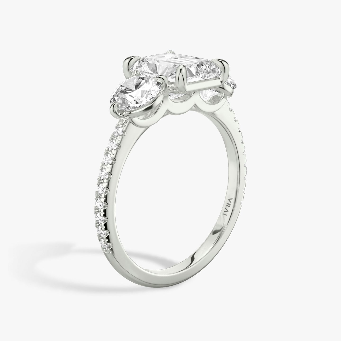 The Three Stone | Radiant | Platinum | bandAccent: Pavé | sideStoneCarat: 0.50ct | sideStoneShape: Round Brilliant | diamondOrientation: vertical | caratWeight: other