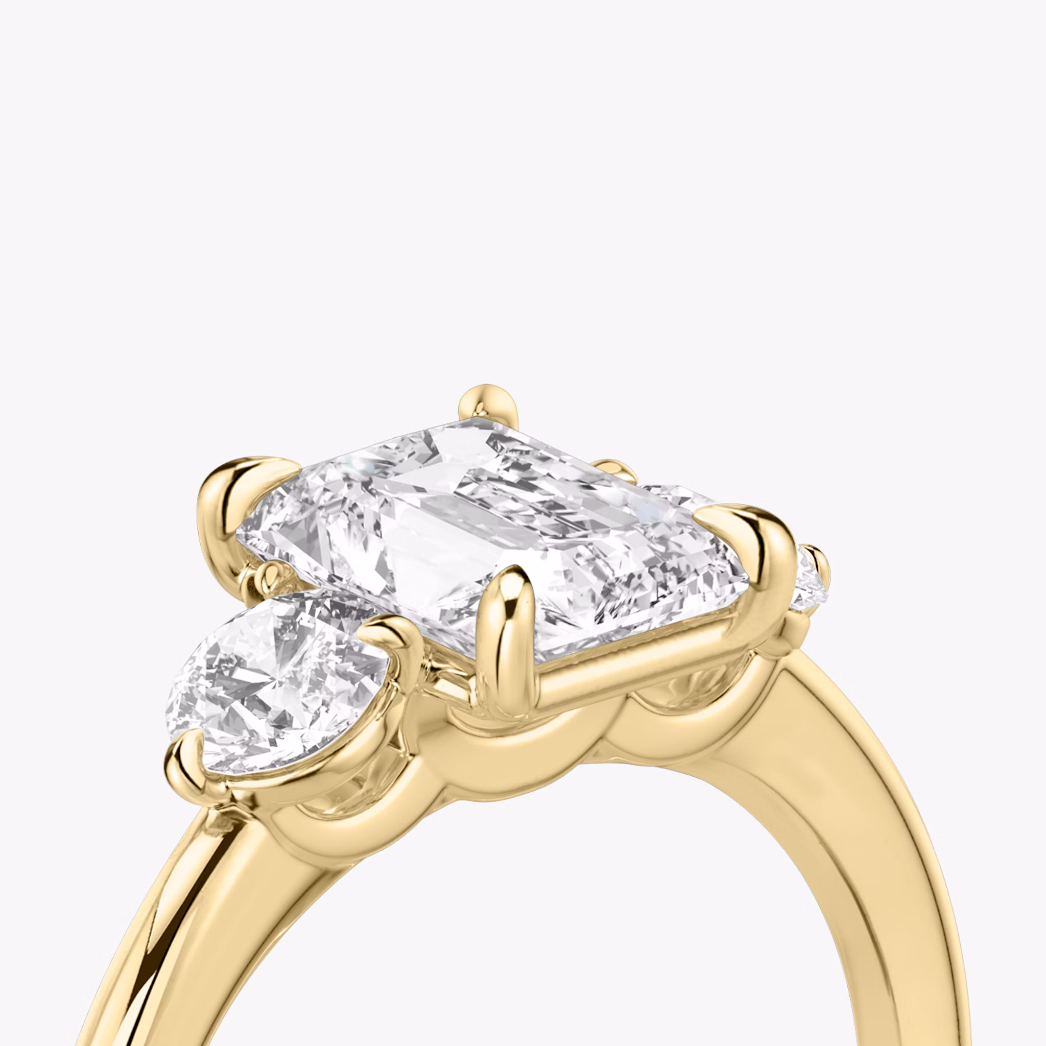 The Three Stone | Radiant | 18k | Yellow Gold | bandAccent: Plain | sideStoneCarat: 0.25ct | sideStoneShape: Round Brilliant | diamondOrientation: vertical | caratWeight: other