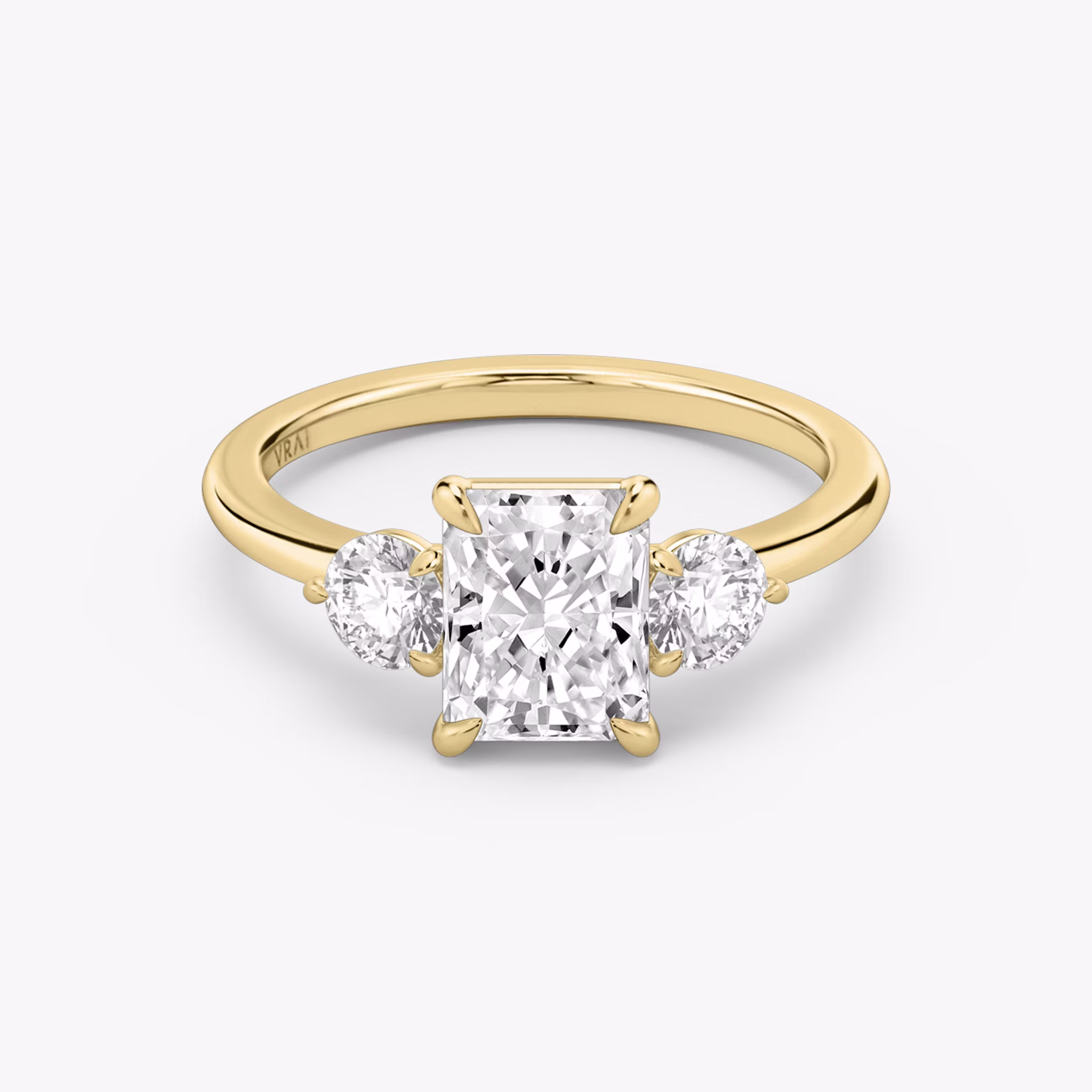 The Three Stone | Radiant | 18k | Yellow Gold | bandAccent: Plain | sideStoneCarat: 0.25ct | sideStoneShape: Round Brilliant | diamondOrientation: vertical | caratWeight: other