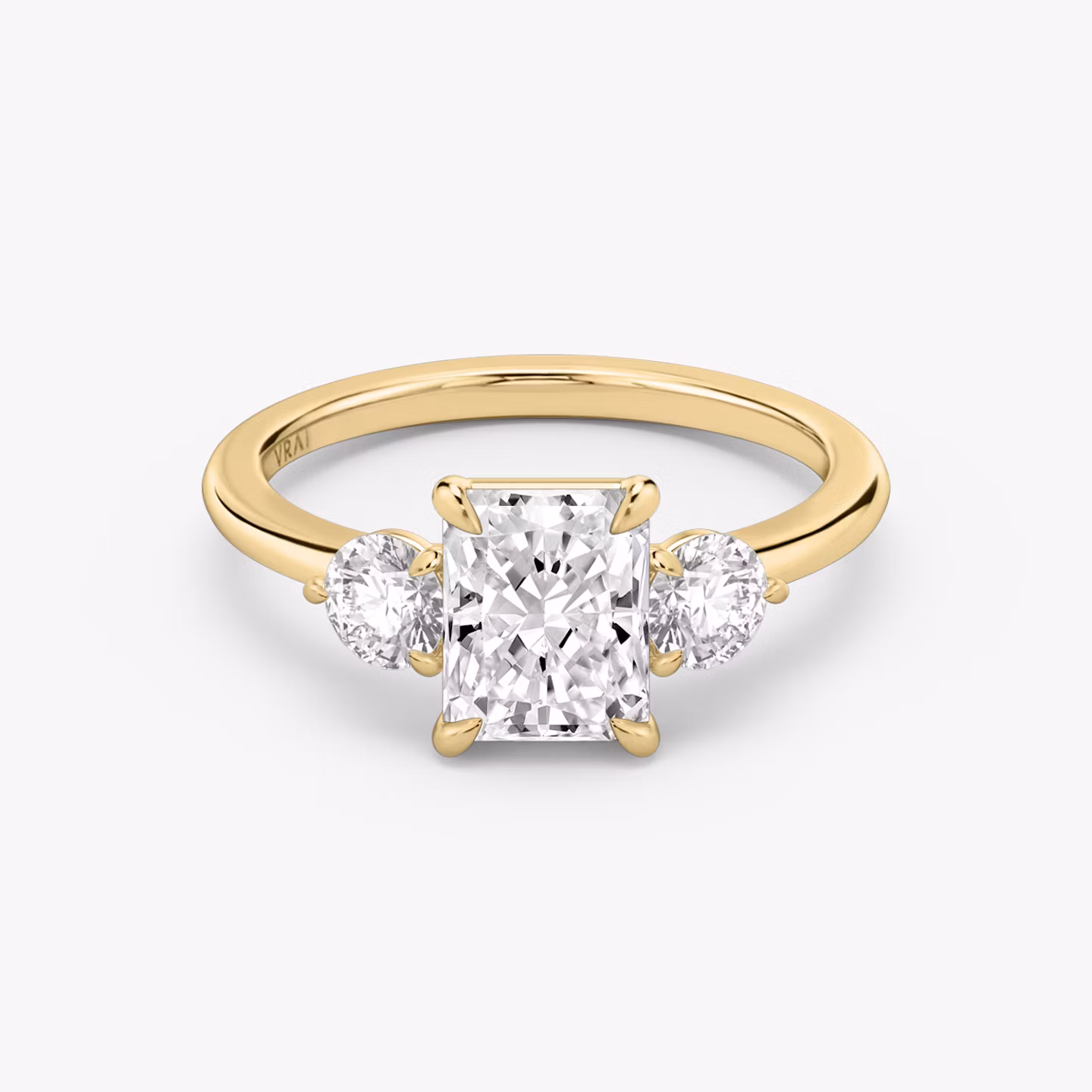 The Three Stone | Radiant | 18k | Yellow Gold | bandAccent: Plain | sideStoneCarat: 0.25ct | sideStoneShape: Round Brilliant | diamondOrientation: vertical | caratWeight: other