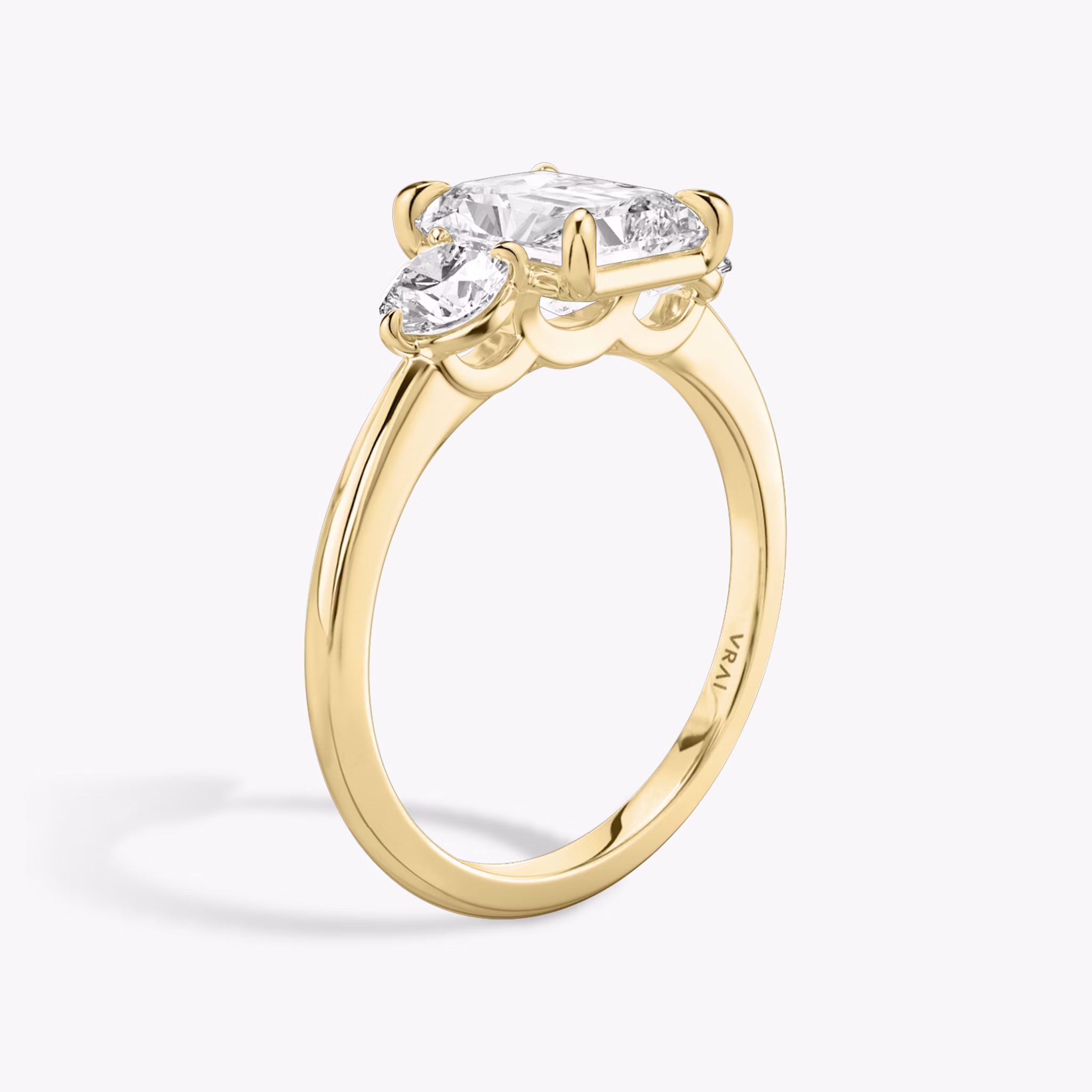 The Three Stone | Radiant | 18k | Yellow Gold | bandAccent: Plain | sideStoneCarat: 0.25ct | sideStoneShape: Round Brilliant | diamondOrientation: vertical | caratWeight: other