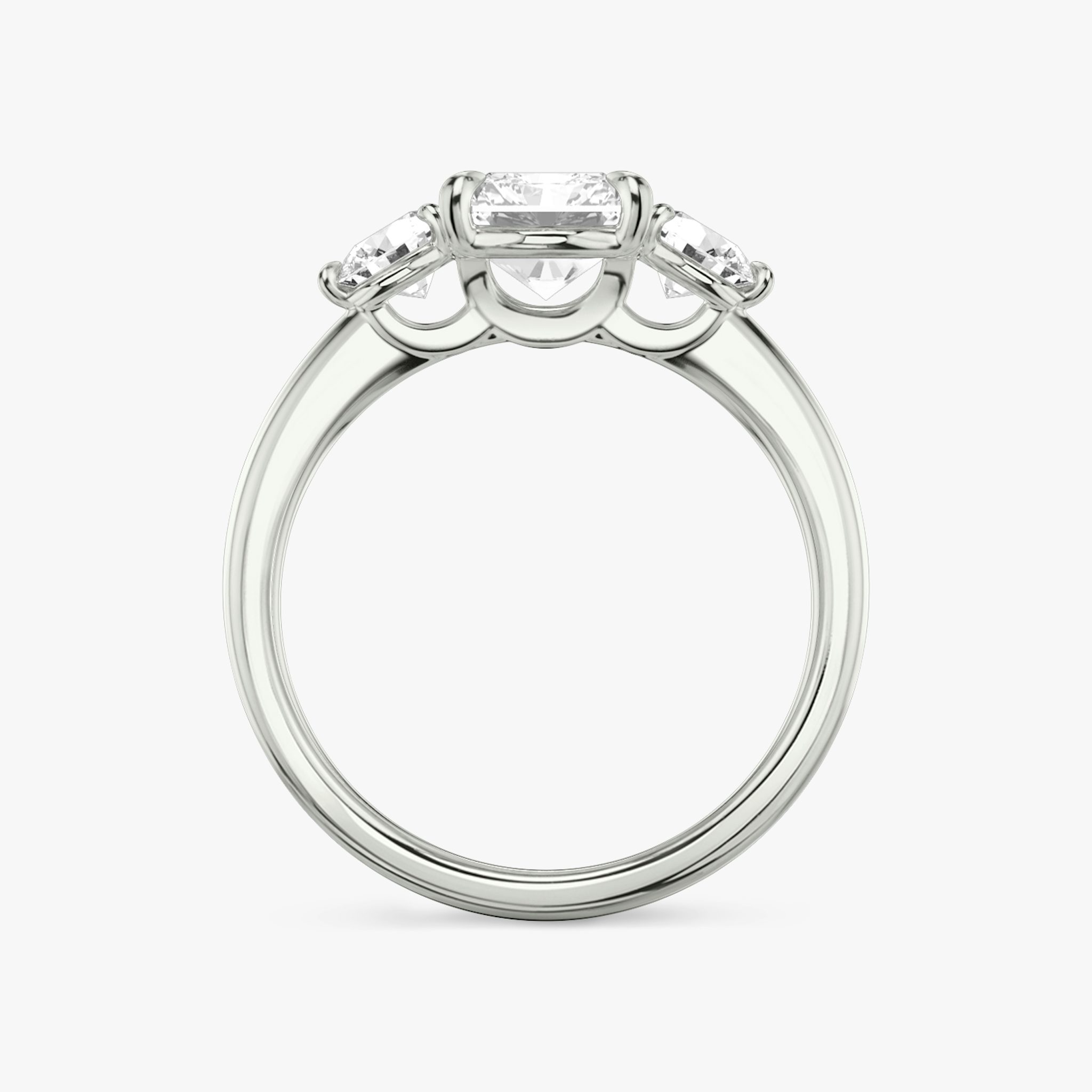 The Three Stone | Radiant | 18k | White Gold | bandAccent: Plain | sideStoneCarat: 0.25ct | sideStoneShape: Round Brilliant | diamondOrientation: vertical | caratWeight: other