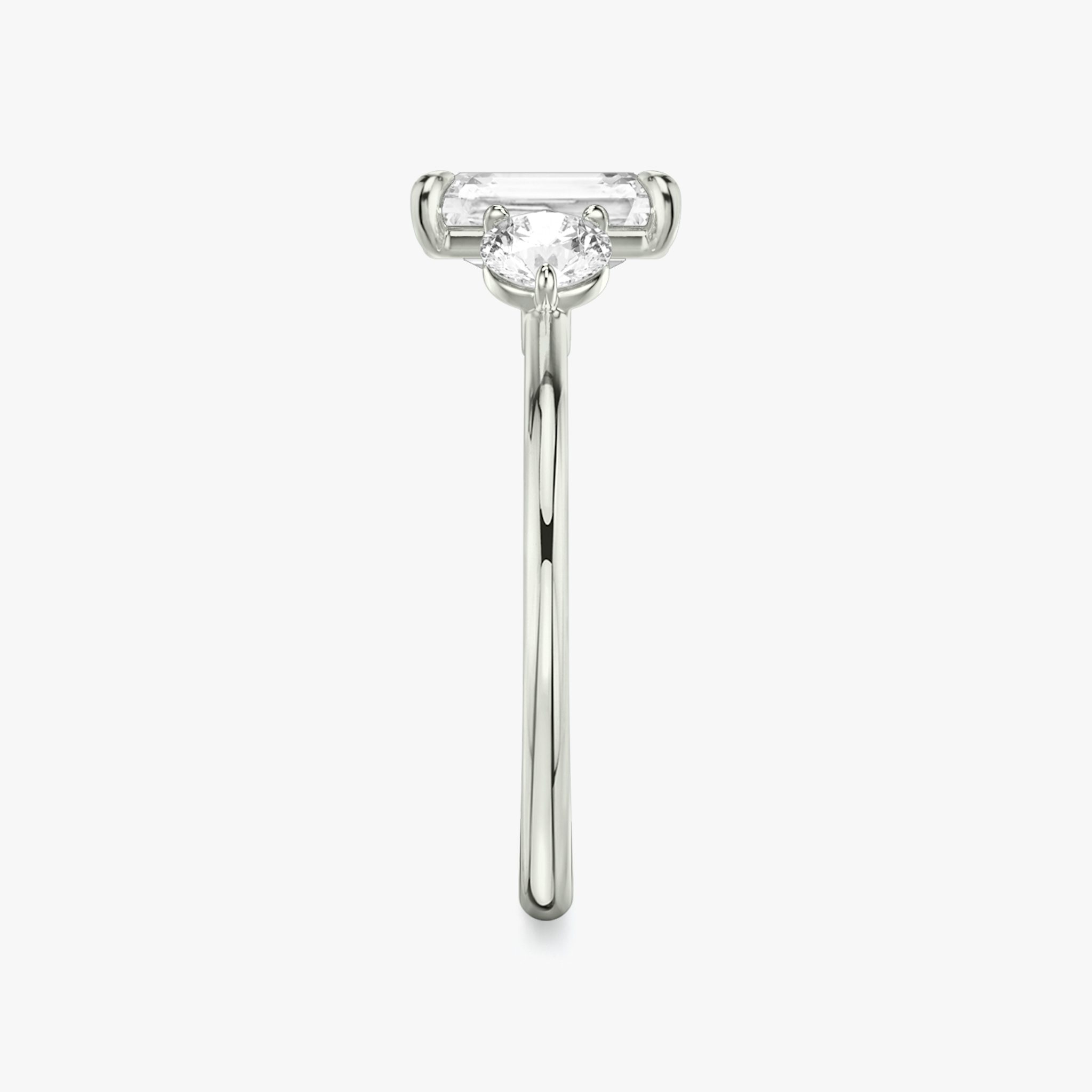 The Three Stone | Radiant | 18k | White Gold | bandAccent: Plain | sideStoneCarat: 0.25ct | sideStoneShape: Round Brilliant | diamondOrientation: vertical | caratWeight: other