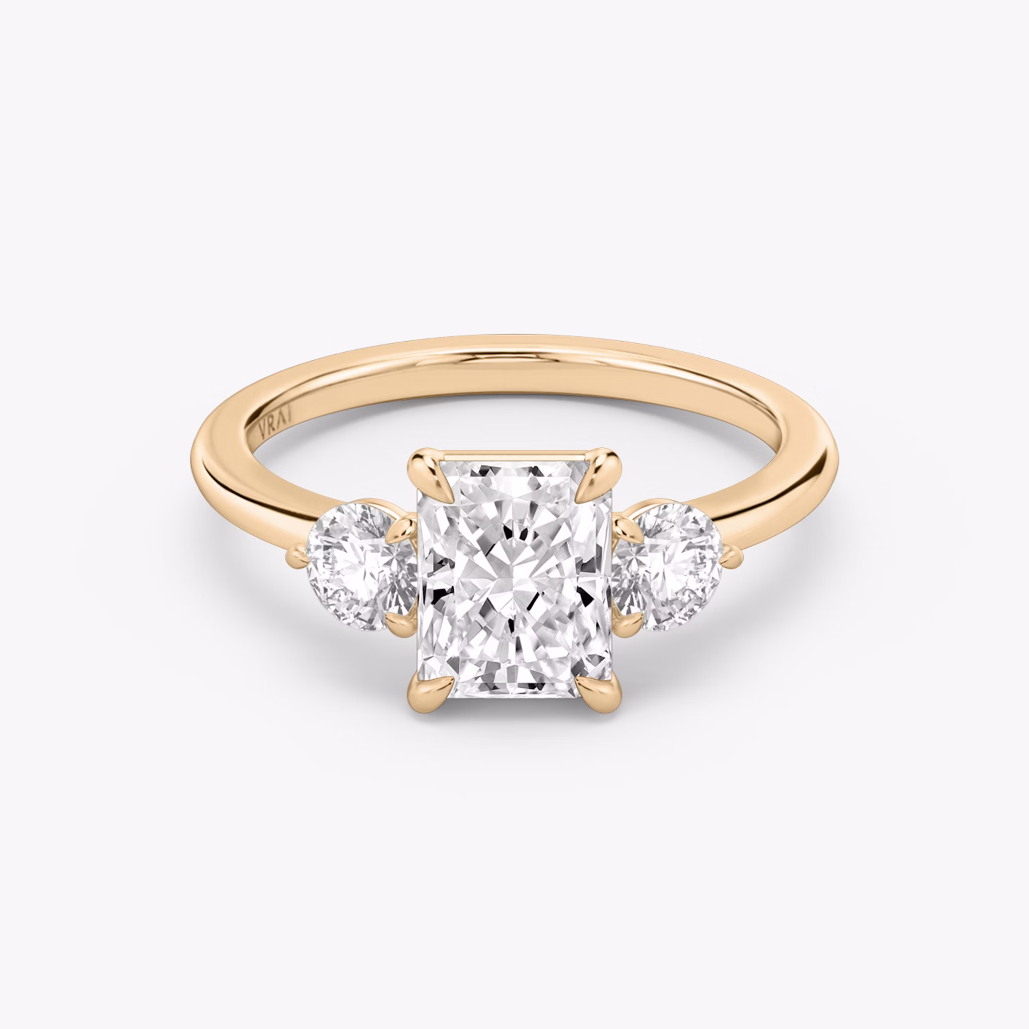 The Three Stone | Radiant | 14k | Rose Gold | bandAccent: Plain | sideStoneCarat: 0.25ct | sideStoneShape: Round Brilliant | diamondOrientation: vertical | caratWeight: other
