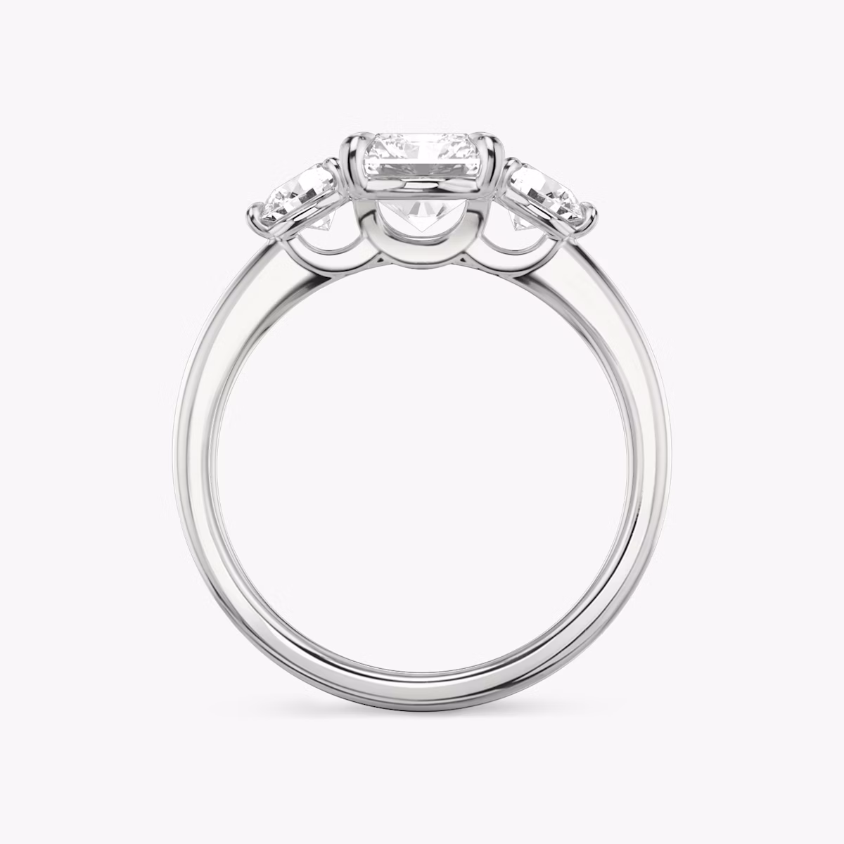 The Three Stone | Radiant | Platinum | bandAccent: Plain | sideStoneCarat: 0.25ct | sideStoneShape: Round Brilliant | diamondOrientation: vertical | caratWeight: other
