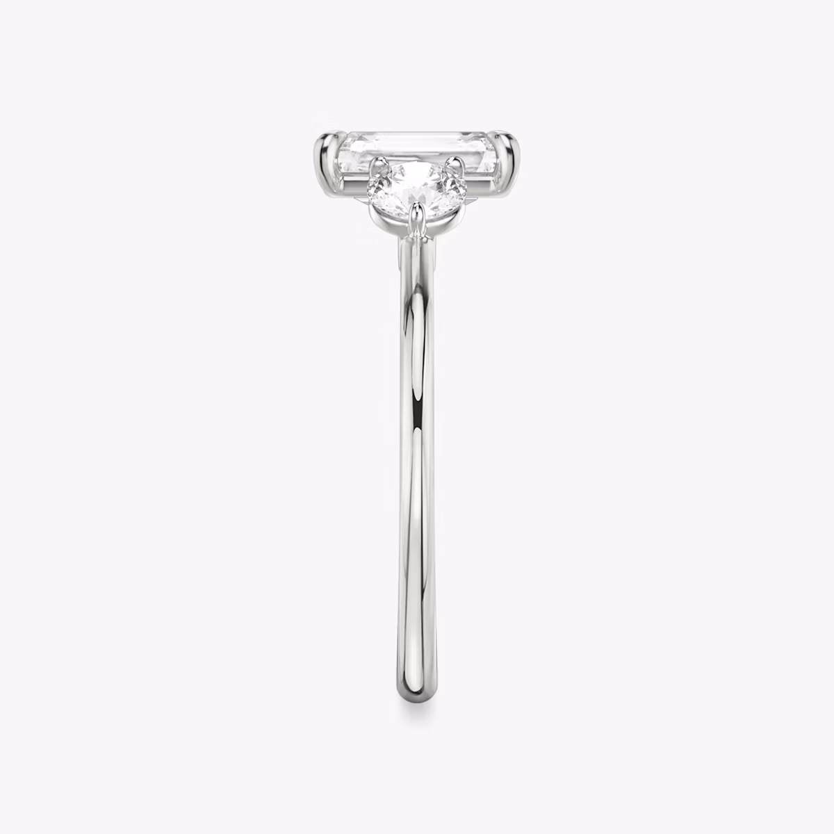The Three Stone | Radiant | Platinum | bandAccent: Plain | sideStoneCarat: 0.25ct | sideStoneShape: Round Brilliant | diamondOrientation: vertical | caratWeight: other