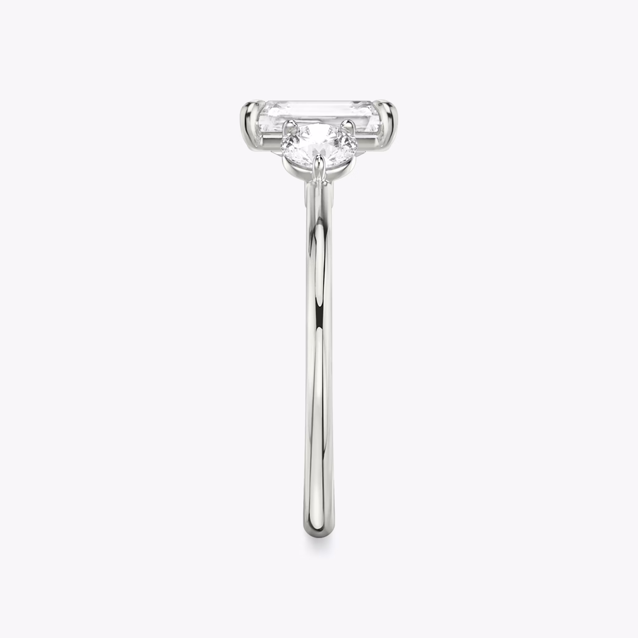 The Three Stone | Radiant | Platinum | bandAccent: Plain | sideStoneCarat: 0.25ct | sideStoneShape: Round Brilliant | diamondOrientation: vertical | caratWeight: other