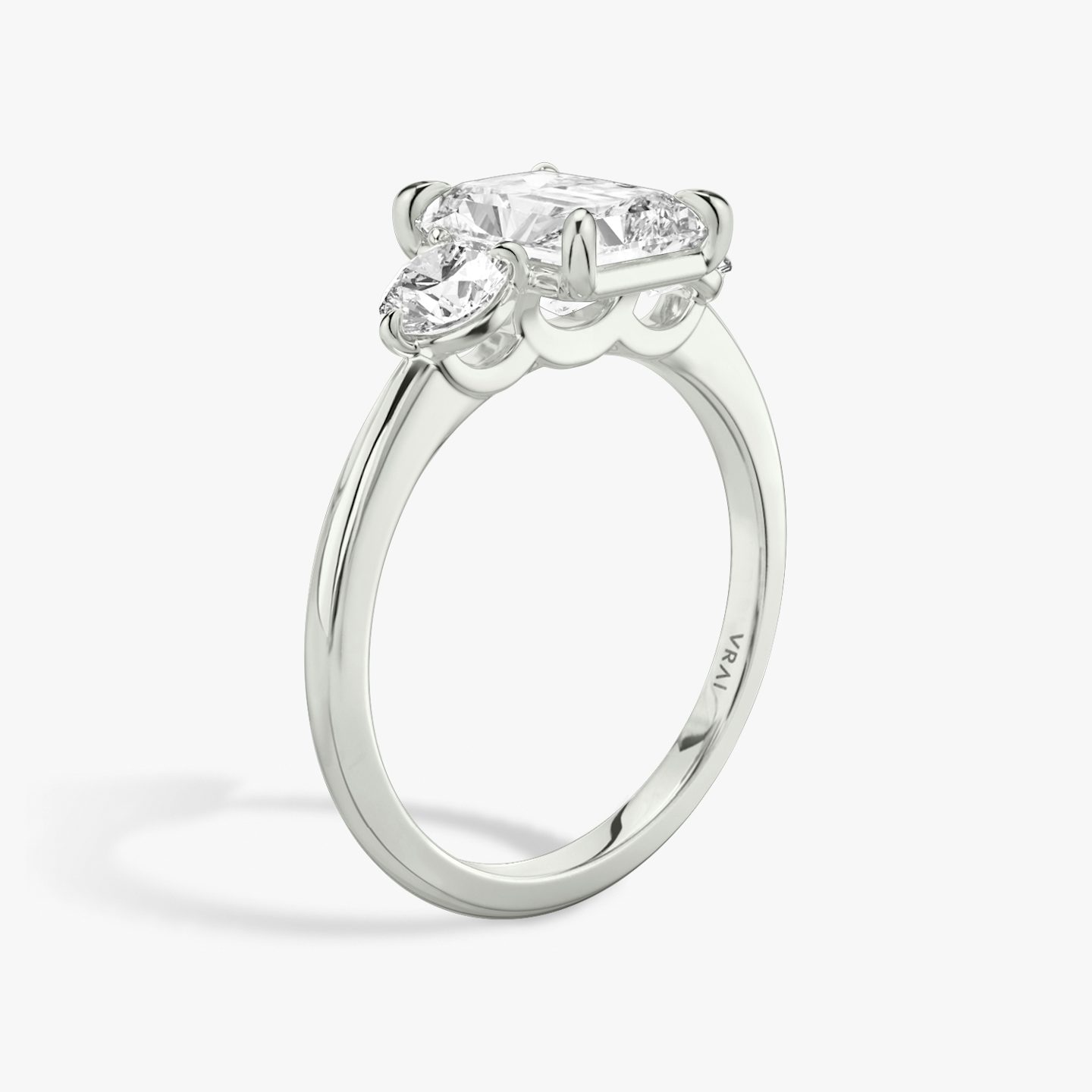 The Three Stone | Radiant | Platinum | bandAccent: Plain | sideStoneCarat: 0.25ct | sideStoneShape: Round Brilliant | diamondOrientation: vertical | caratWeight: other