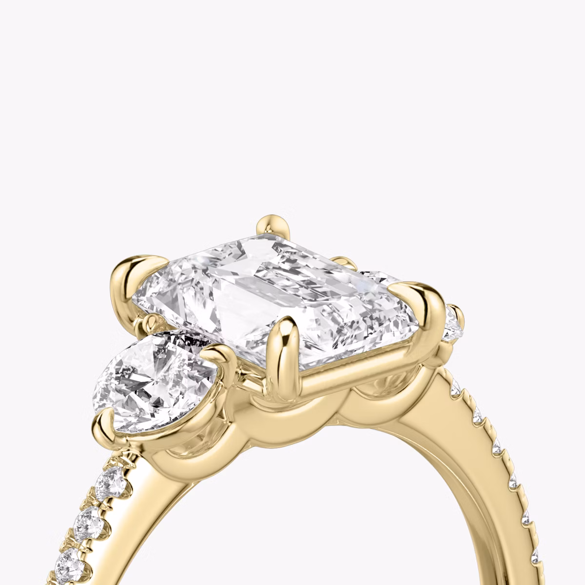 The Three Stone | Radiant | 18k | Yellow Gold | bandAccent: Pavé | sideStoneCarat: 0.25ct | sideStoneShape: Round Brilliant | diamondOrientation: vertical | caratWeight: other
