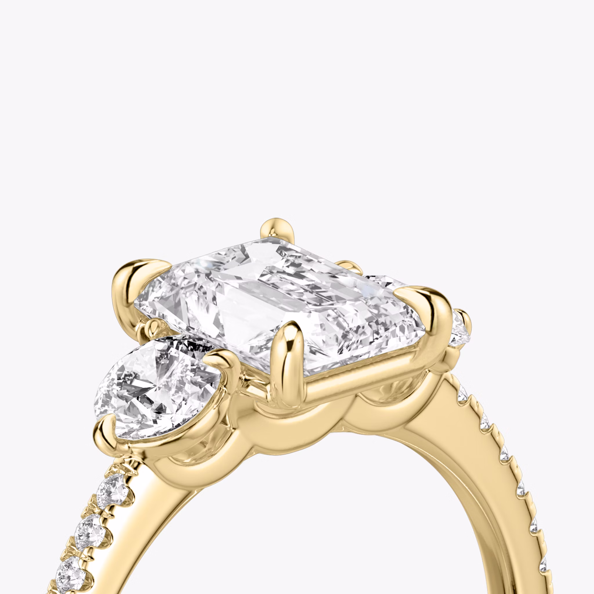The Three Stone | Radiant | 18k | Yellow Gold | bandAccent: Pavé | sideStoneCarat: 0.25ct | sideStoneShape: Round Brilliant | diamondOrientation: vertical | caratWeight: other