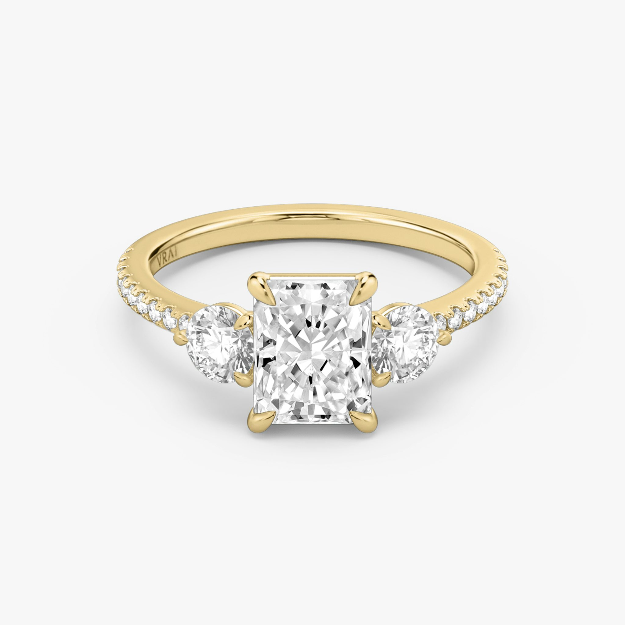 The Three Stone | Radiant | 18k | Yellow Gold | bandAccent: Pavé | sideStoneCarat: 0.25ct | sideStoneShape: Round Brilliant | diamondOrientation: vertical | caratWeight: other
