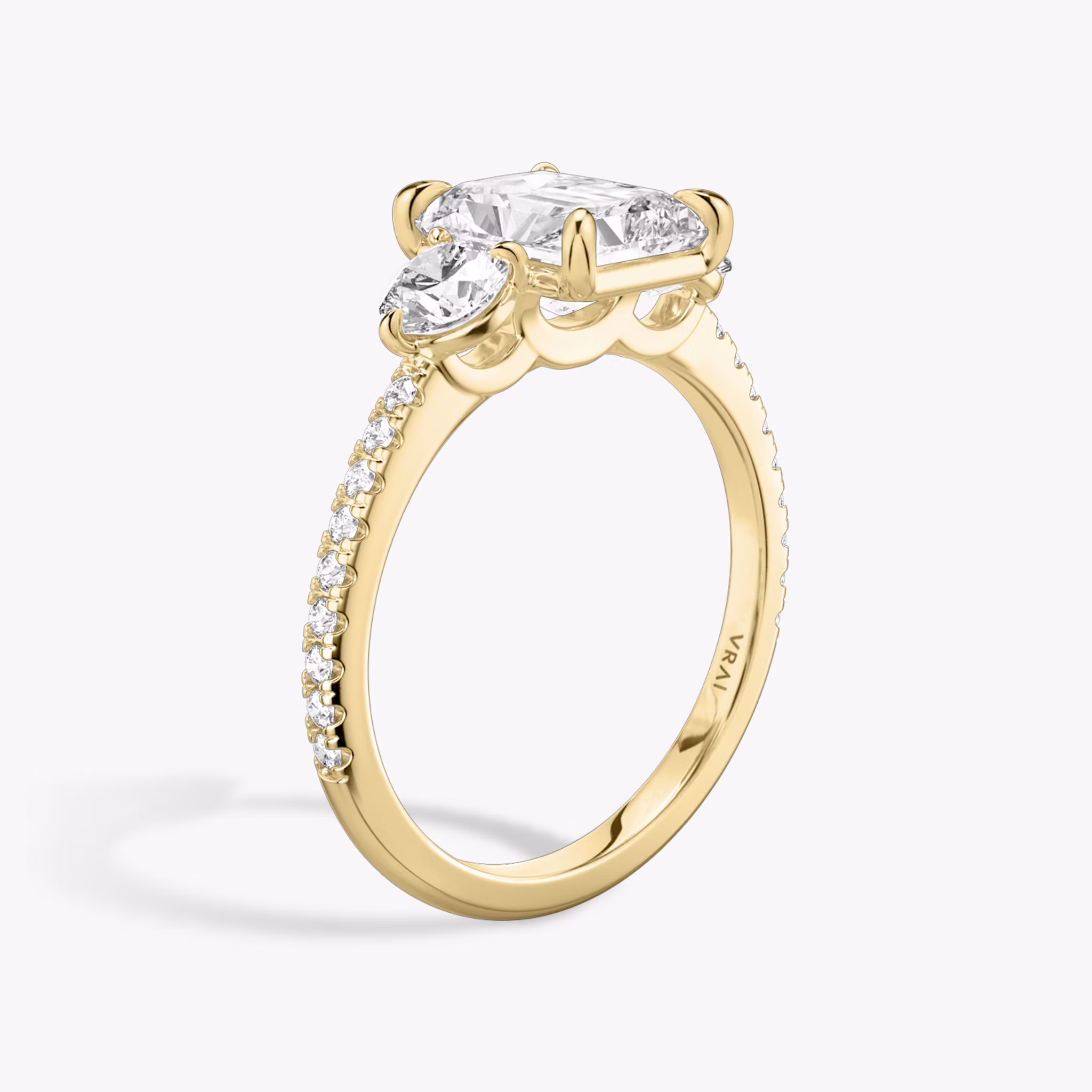 The Three Stone | Radiant | 18k | Yellow Gold | bandAccent: Pavé | sideStoneCarat: 0.25ct | sideStoneShape: Round Brilliant | diamondOrientation: vertical | caratWeight: other