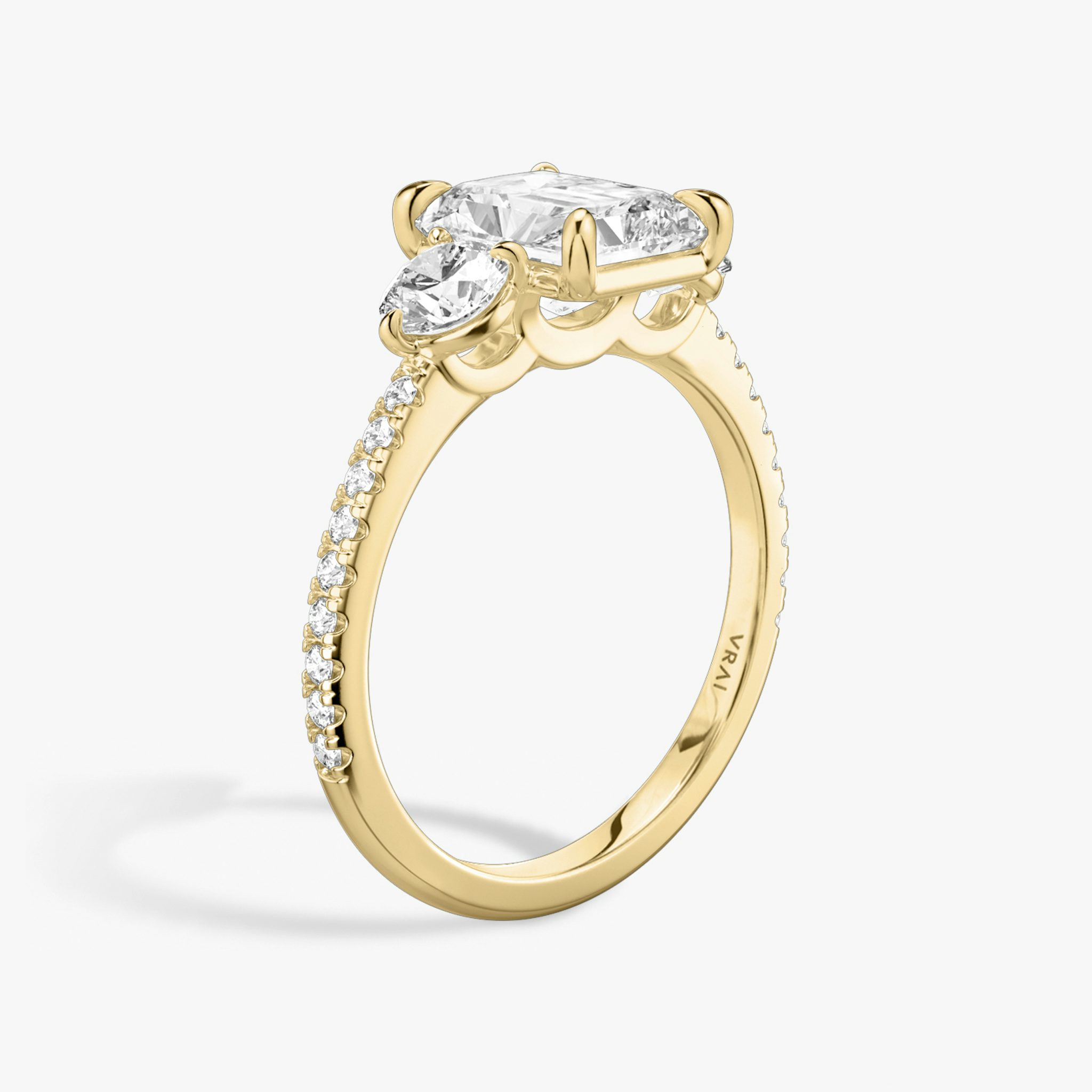 The Three Stone | Radiant | 18k | Yellow Gold | bandAccent: Pavé | sideStoneCarat: 0.25ct | sideStoneShape: Round Brilliant | diamondOrientation: vertical | caratWeight: other