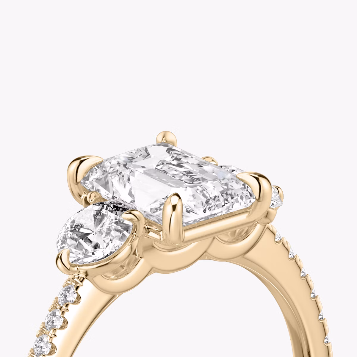 The Three Stone | Radiant | 14k | Rose Gold | bandAccent: Pavé | sideStoneCarat: 0.25ct | sideStoneShape: Round Brilliant | diamondOrientation: vertical | caratWeight: other